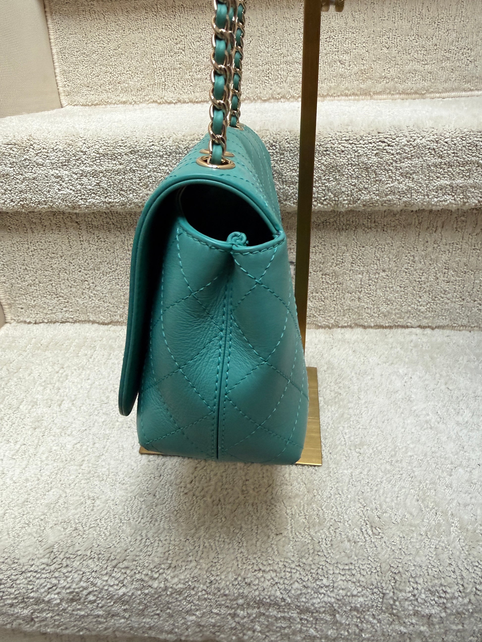 Turquoise Chanel calfskin flap bag with covered CC logo side view
