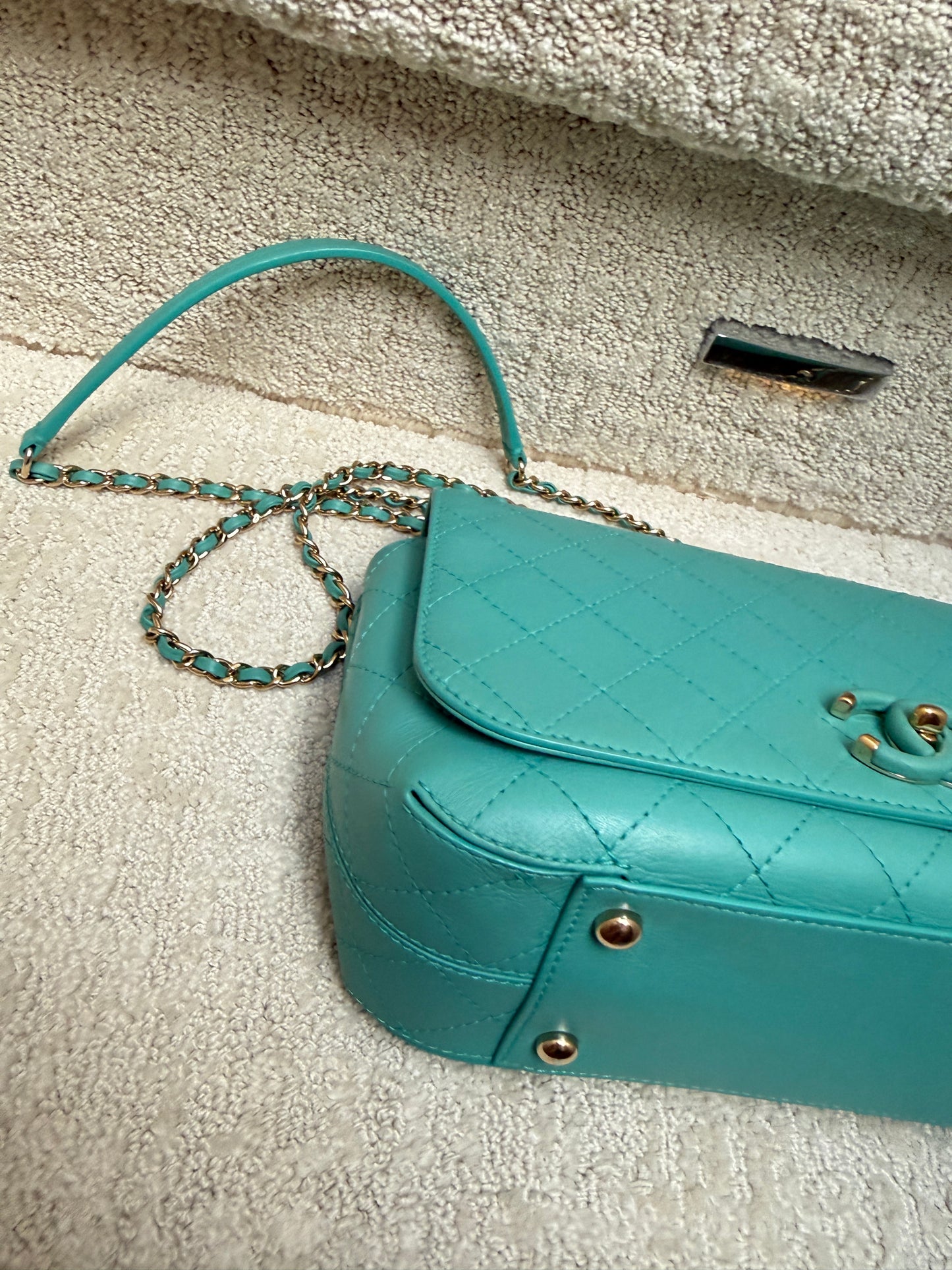 chanel teal medium handbag close up of second corner
