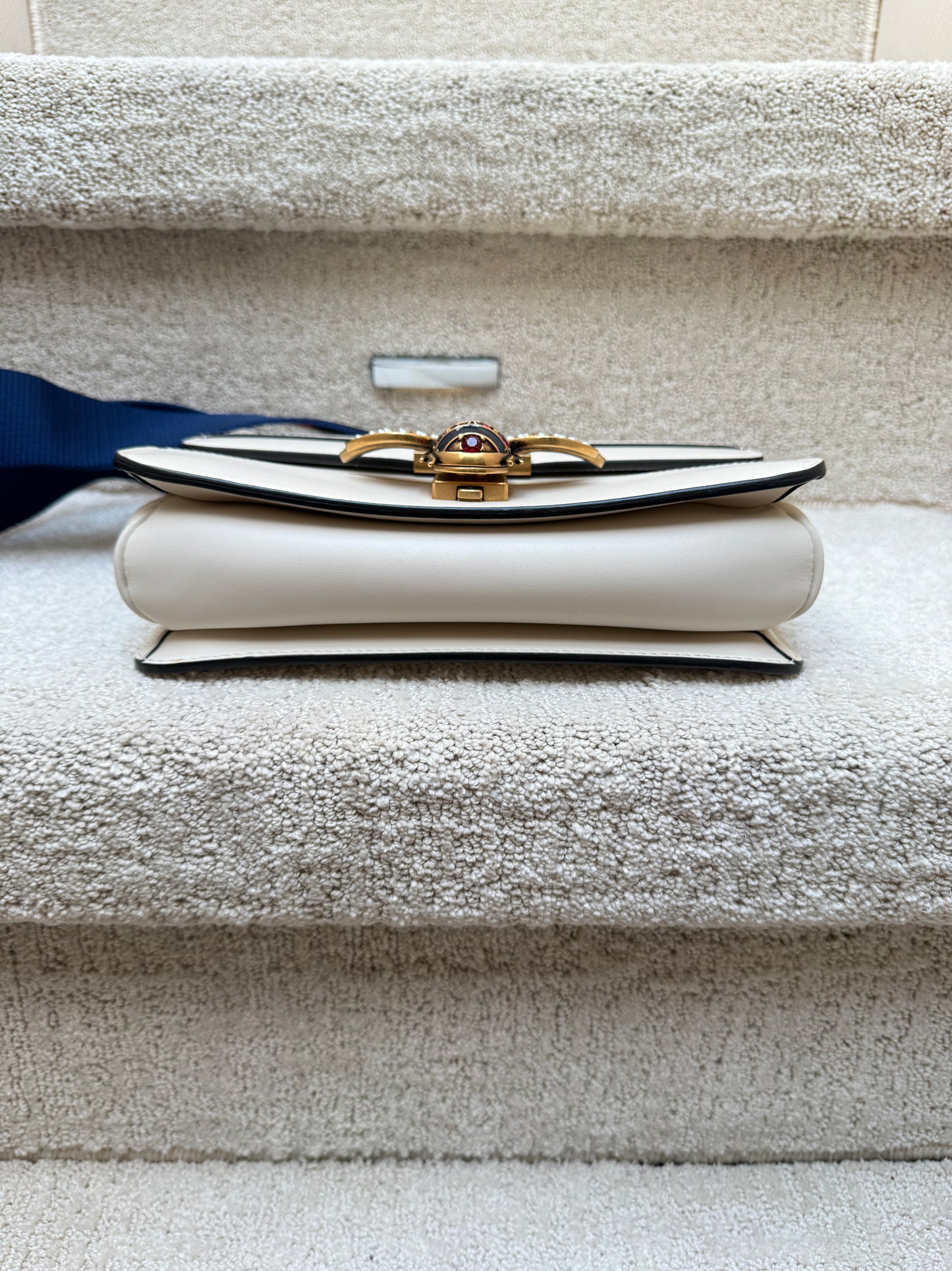 Gucci margaret bee bag white leather view of bottom of handbag
