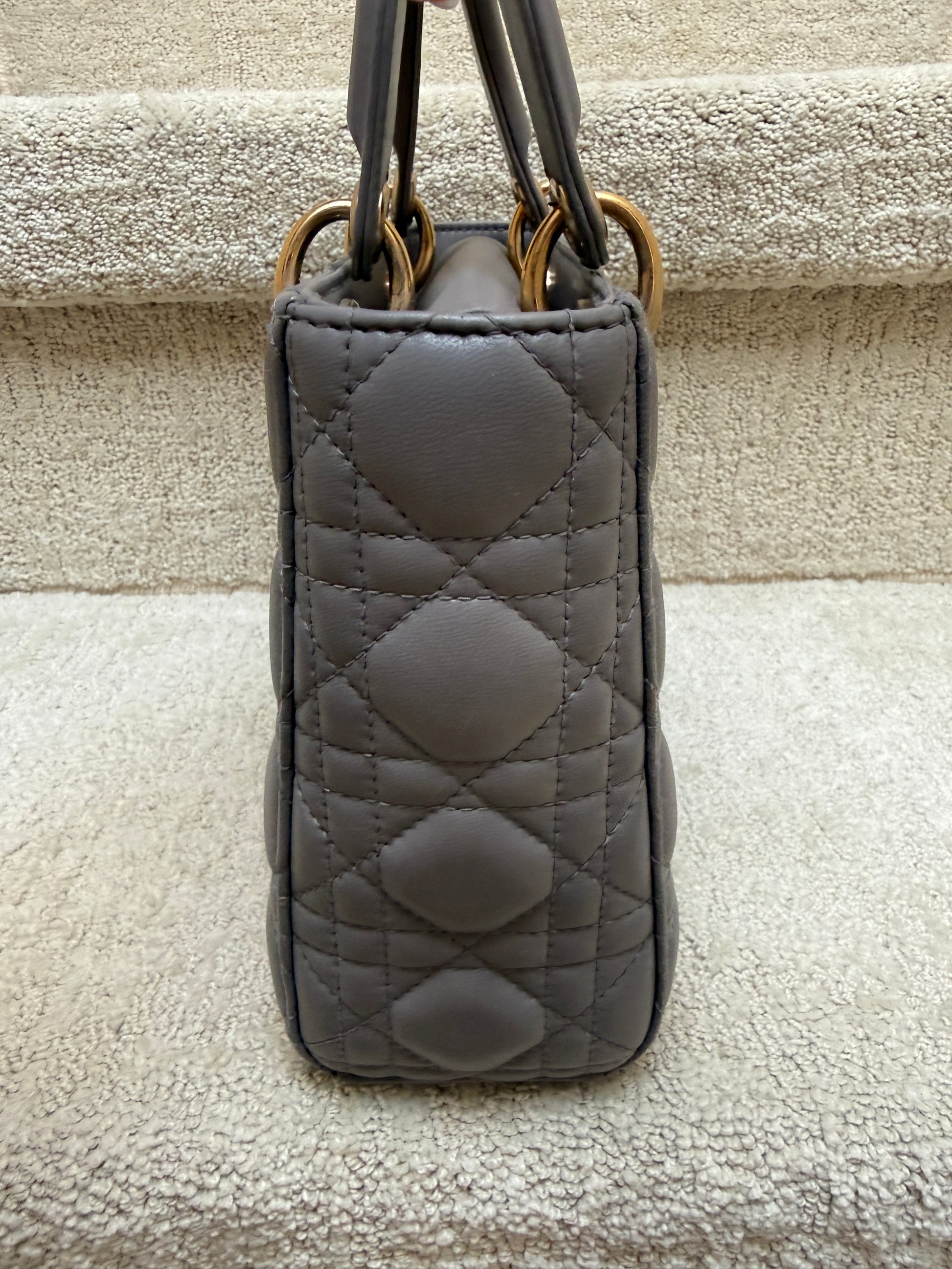 lady dior handbag view of side of bag cannage grey leather