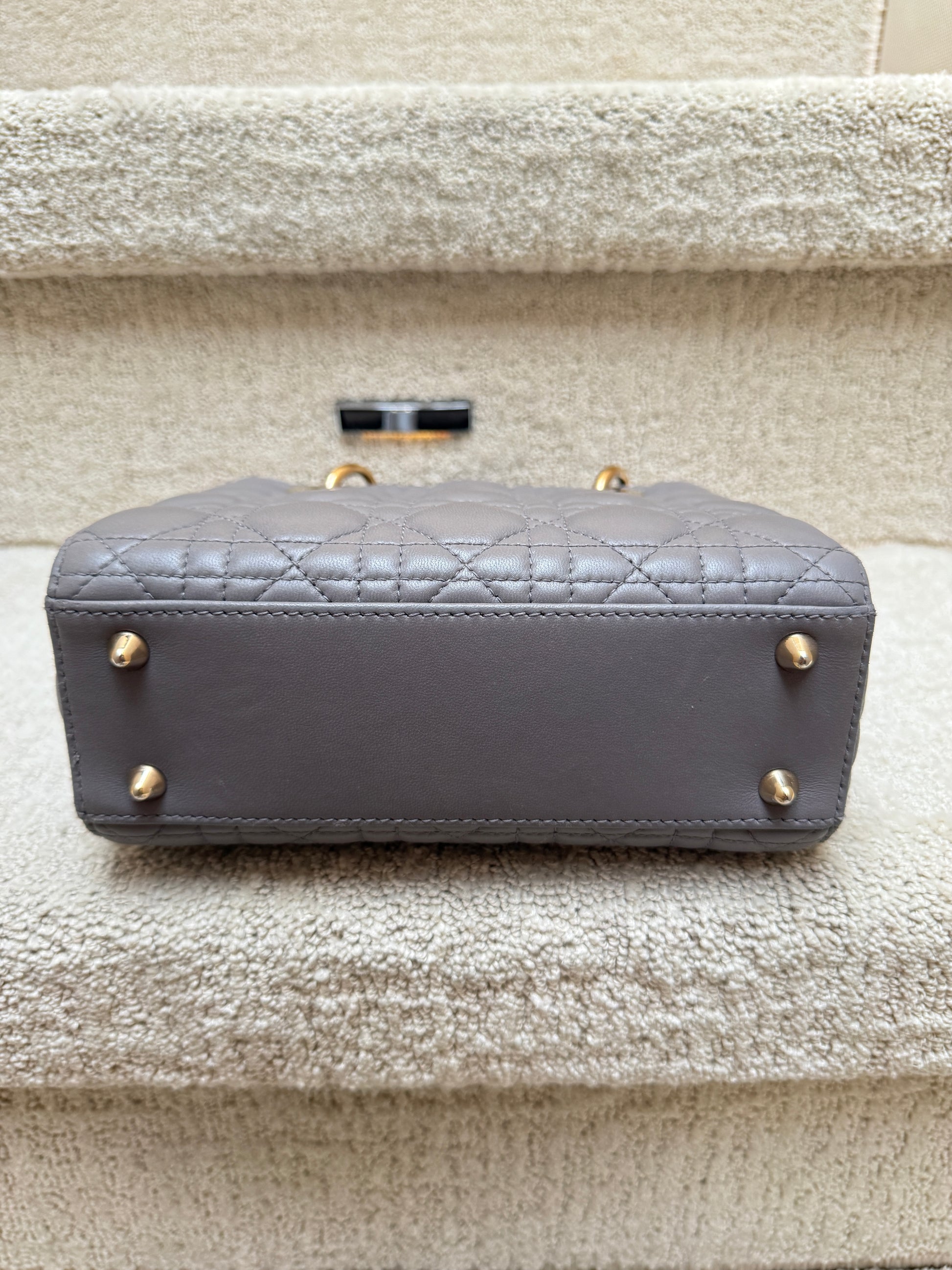 christian dior lady dior purse view of bottom of bag with feet