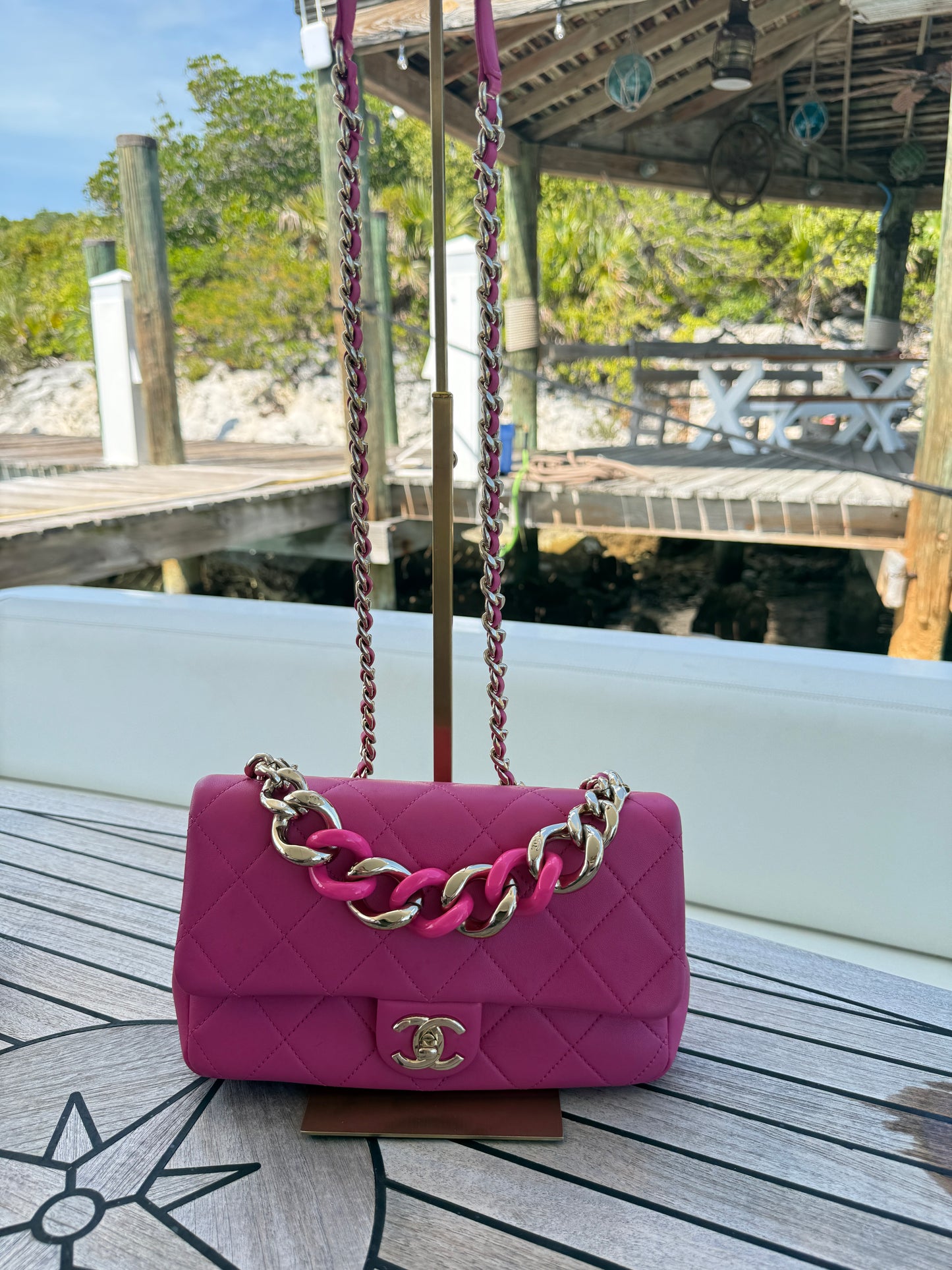 Chain elegant chain flap bag in hot pink showing full bag with threaded chain strap