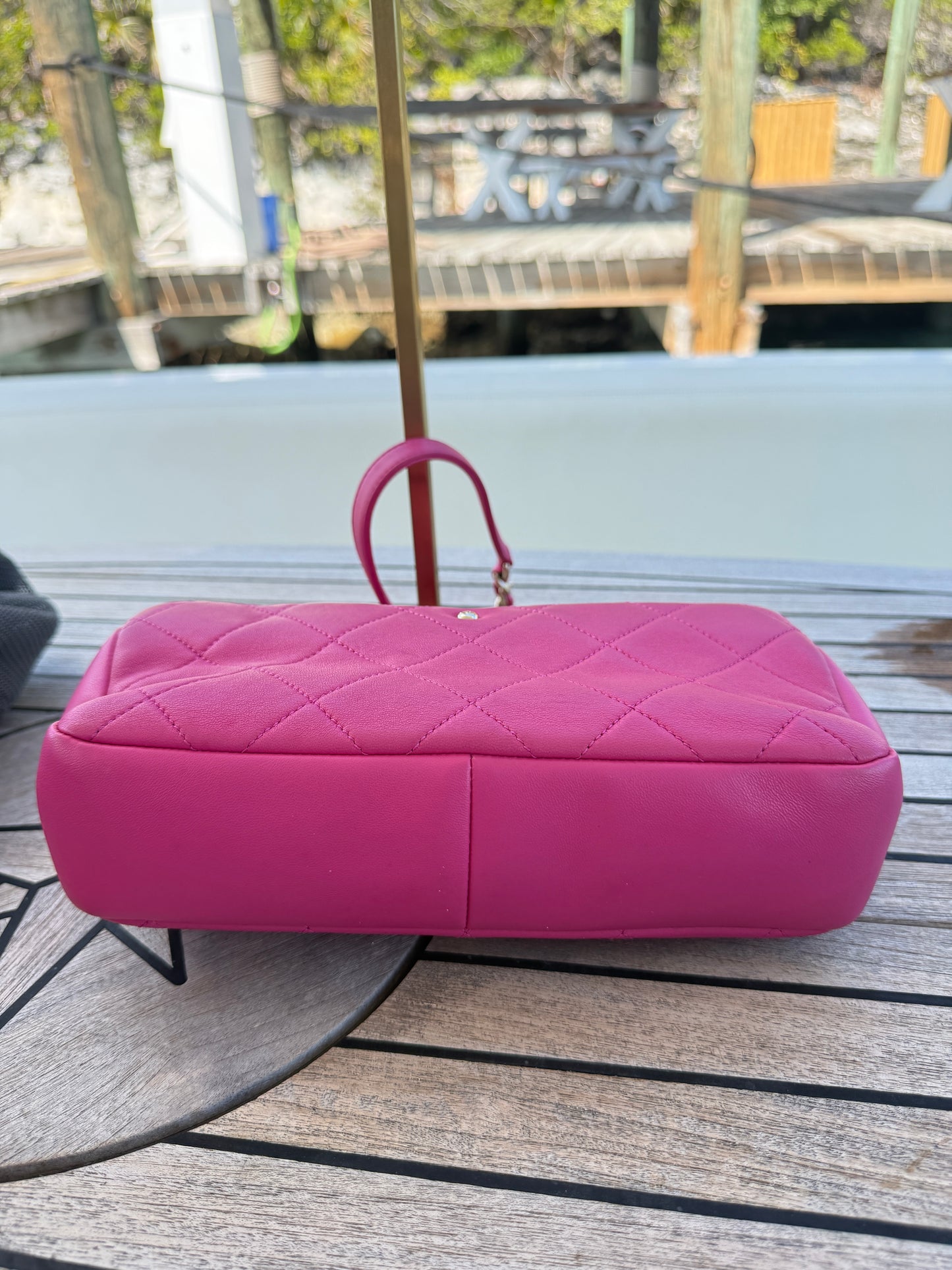 Chanel chain flap in hot pink view of bottom of bag