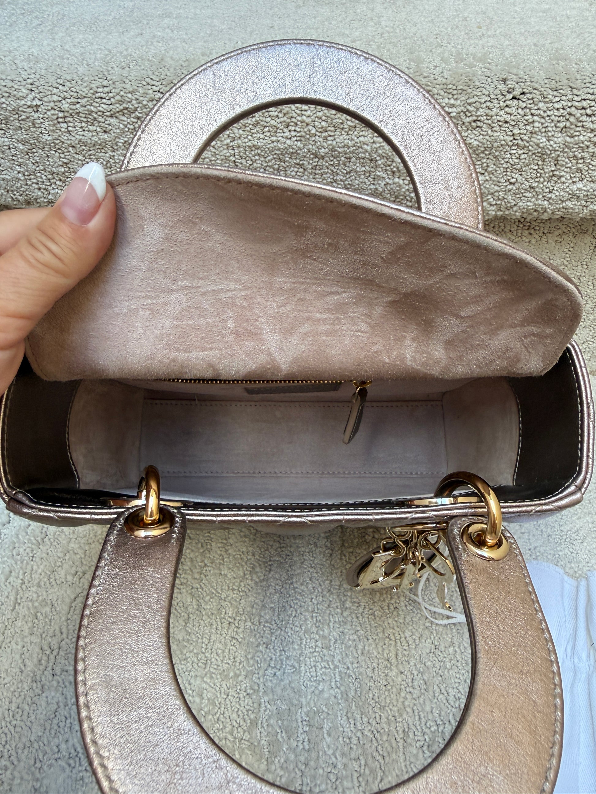 Clean Leather interior of lady dior handbag in pink metallic lambskin leather with gold hardware