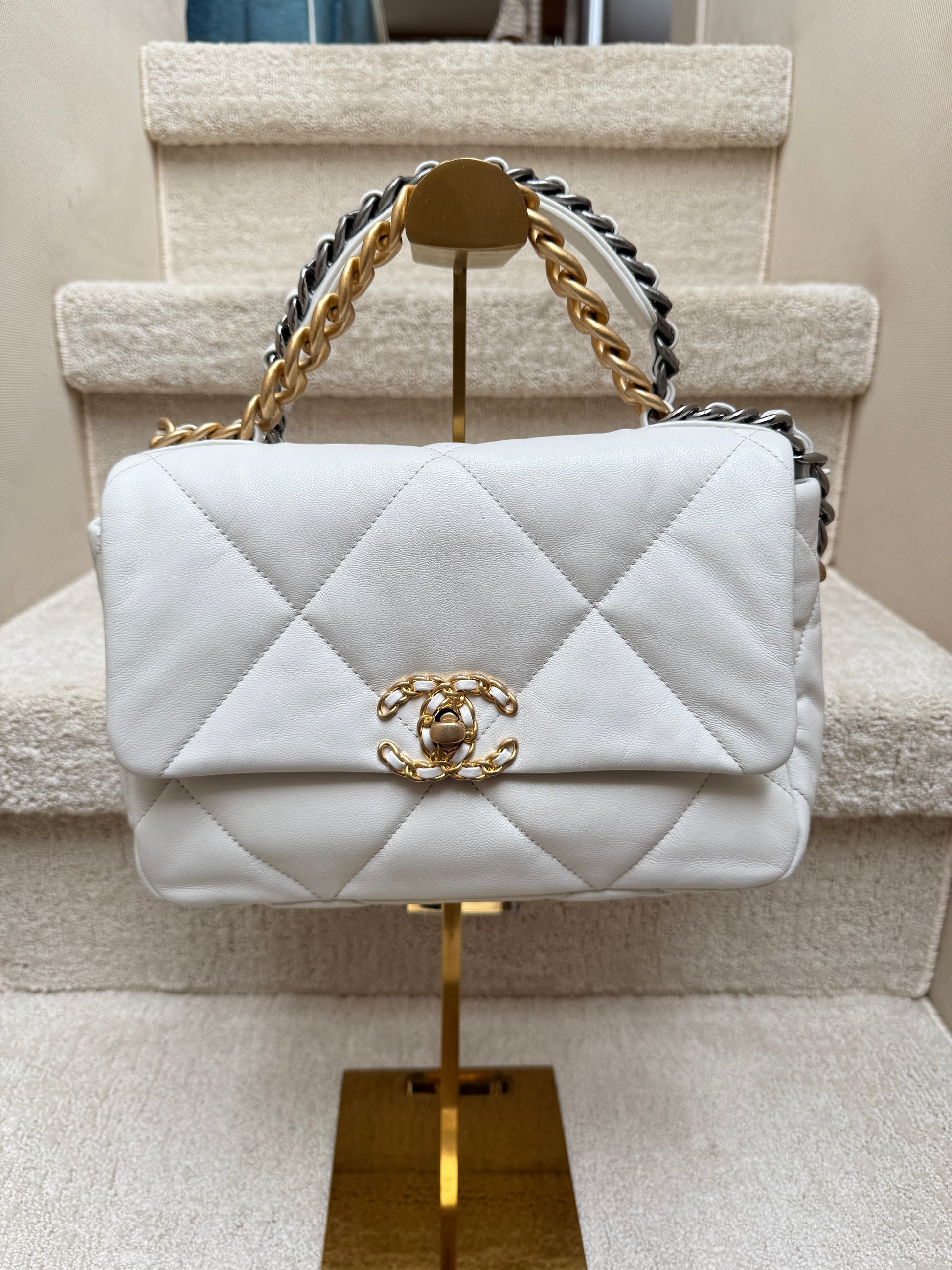 Front view of authenticated Chanel 19 small white leather curated from purseonalshopper