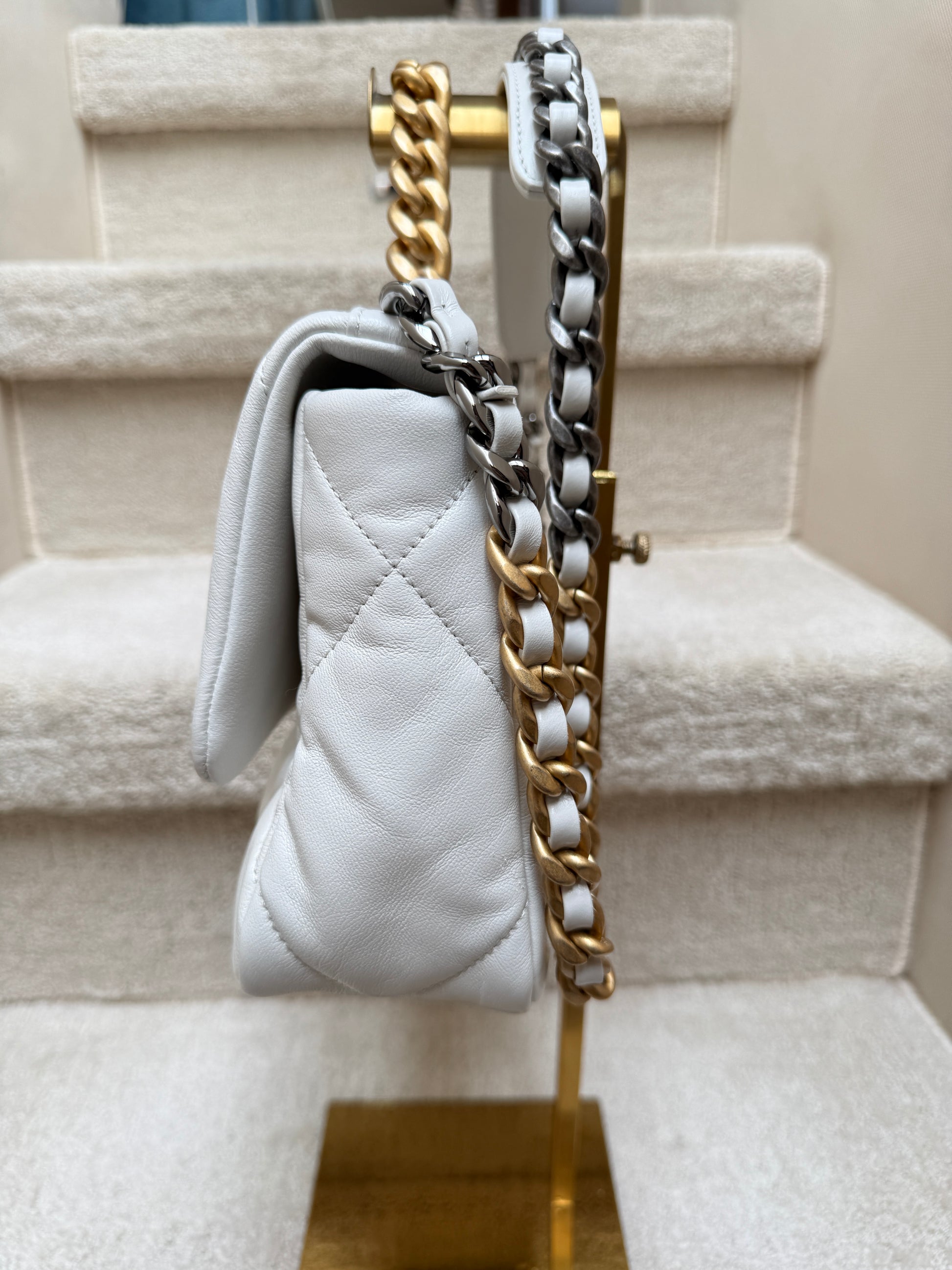 Side profile view of chanel 19 showing pillowy soft leather and clean edges