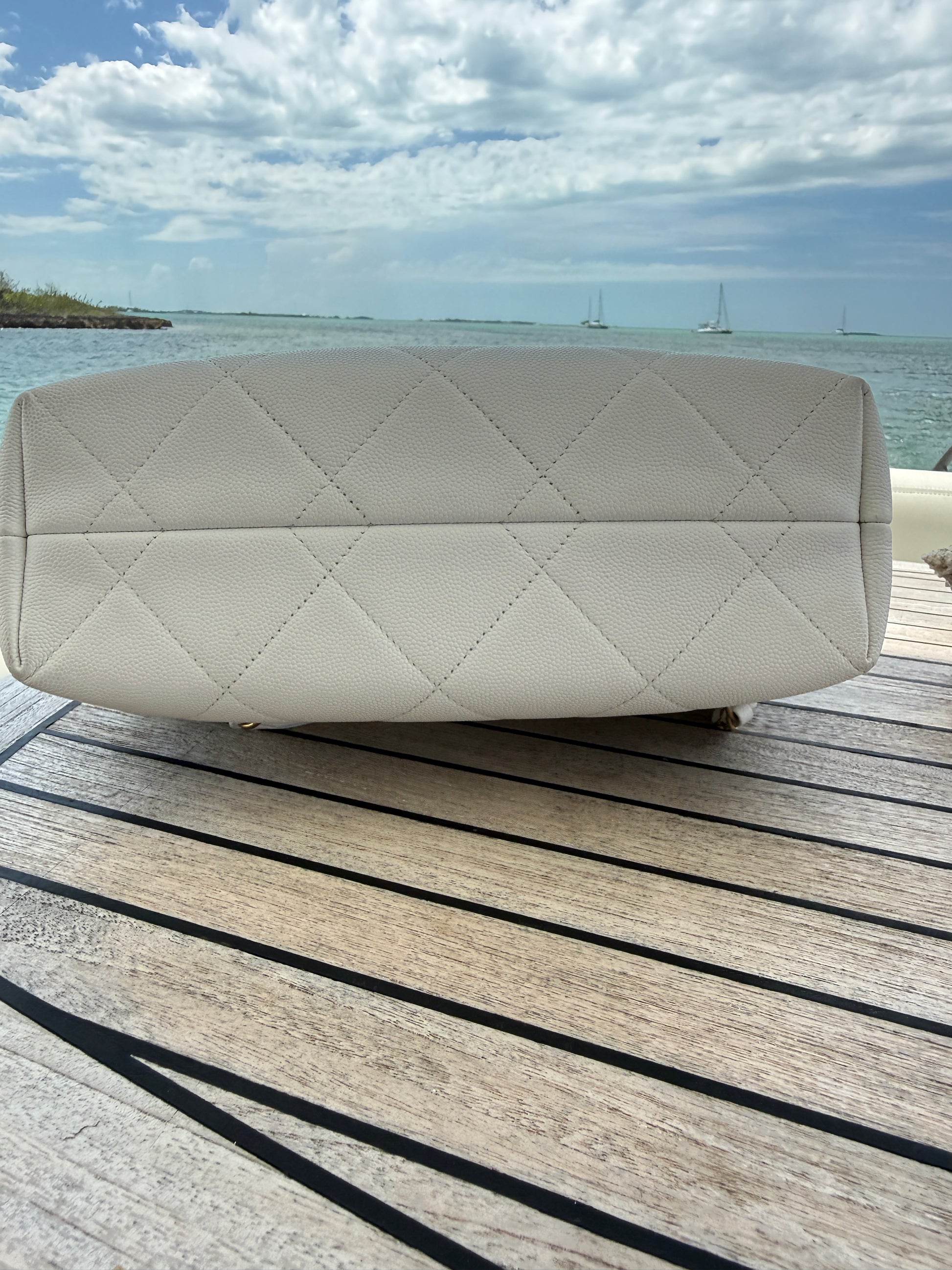 chanel white caviar purse view of bottom of bag.