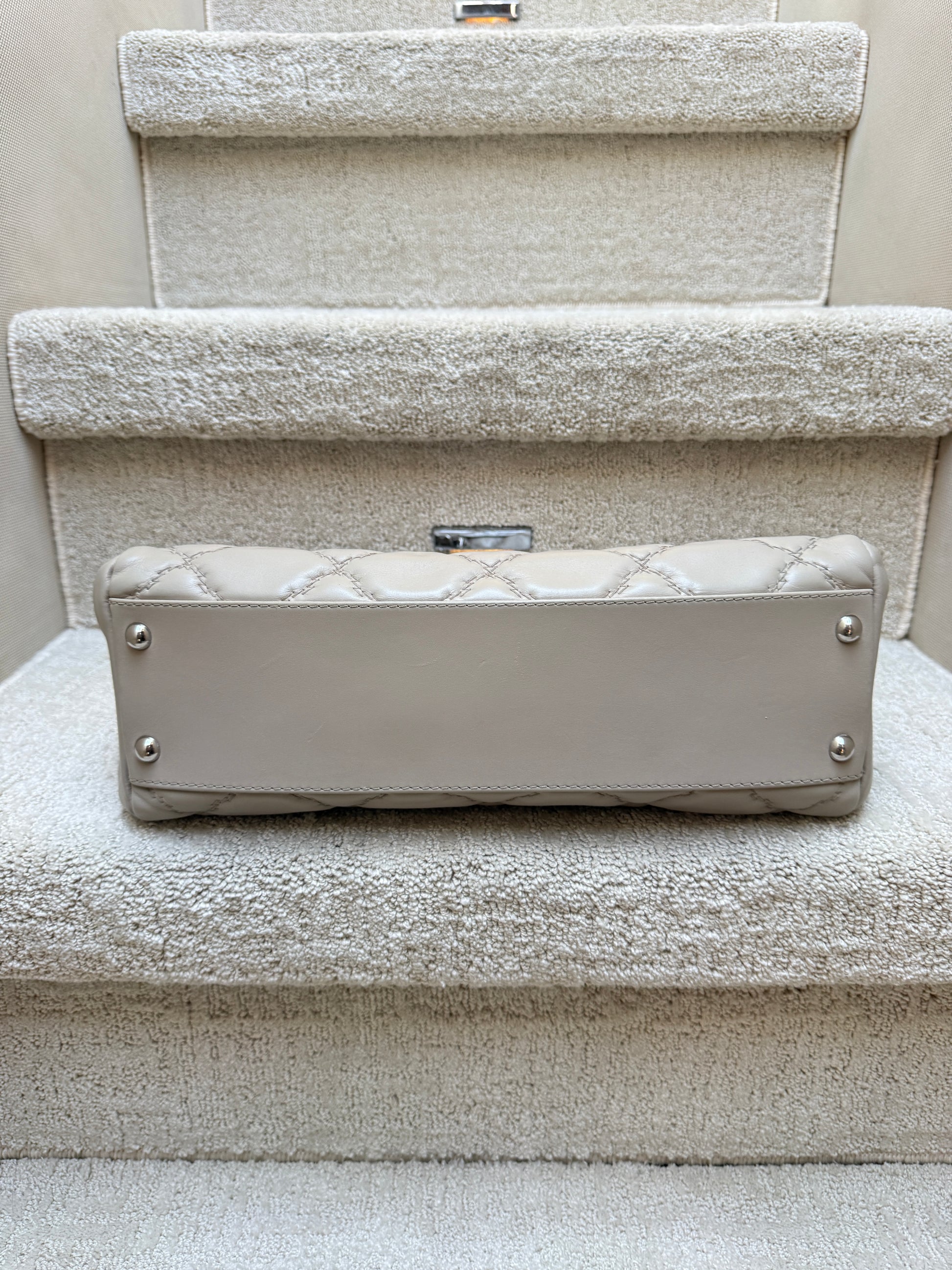 Chanel beige lambskin bag bottom view