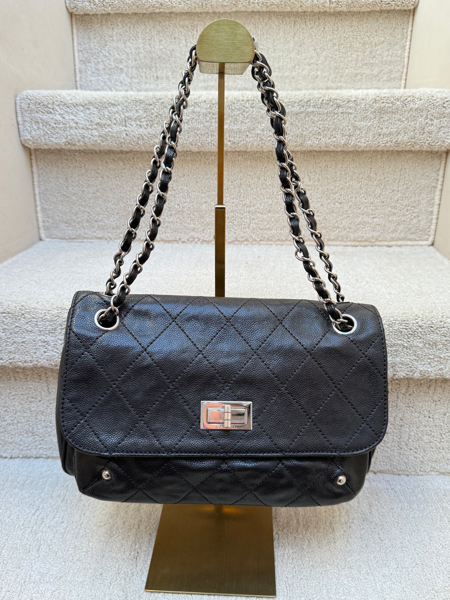 Chanel 2.55 caviar flap handbag in black calfskin leather with silver hardware full front view