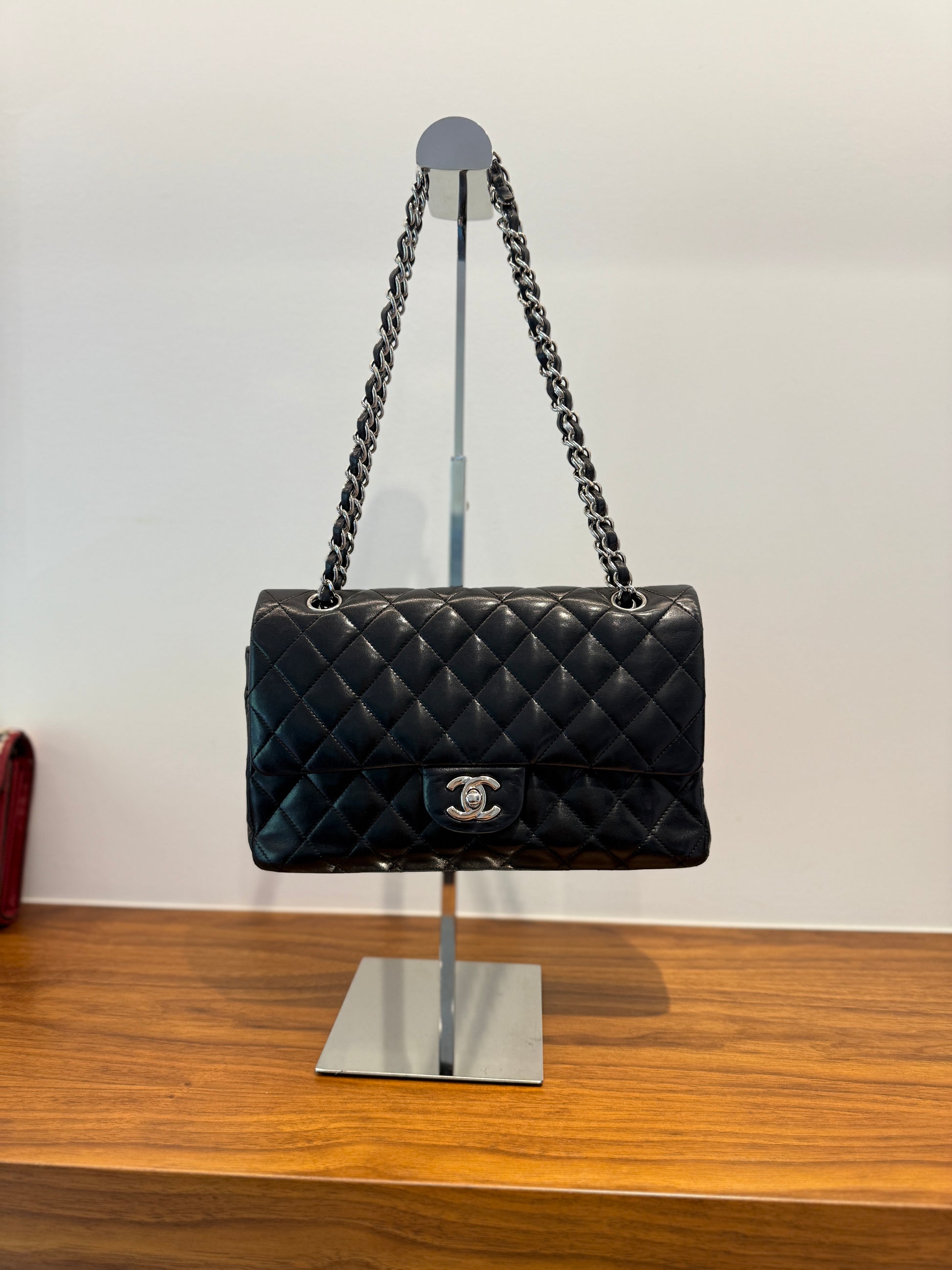 This is a classic classic double flap in black lambskin leather with silver hardware which is preowned and authentic from purseonalshopper.
