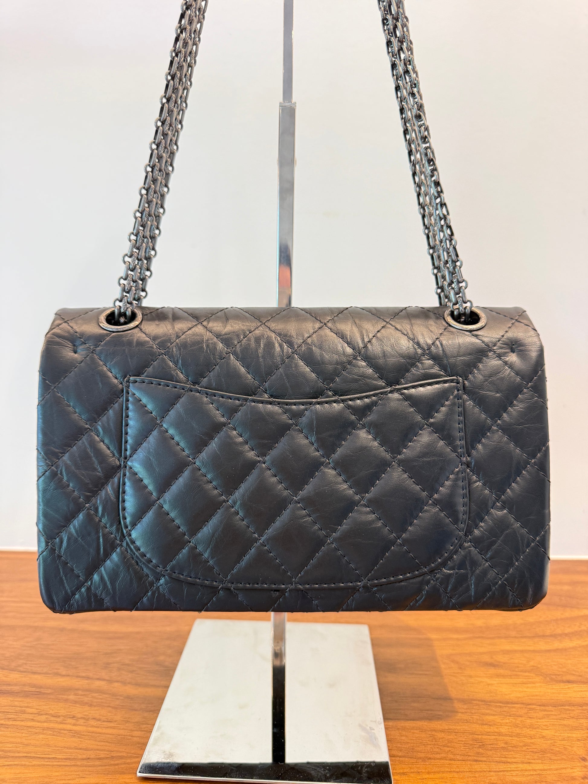 View of back side of chanel 2.55 classic flap in black aged calfskin offered for sale from purseonalshopper