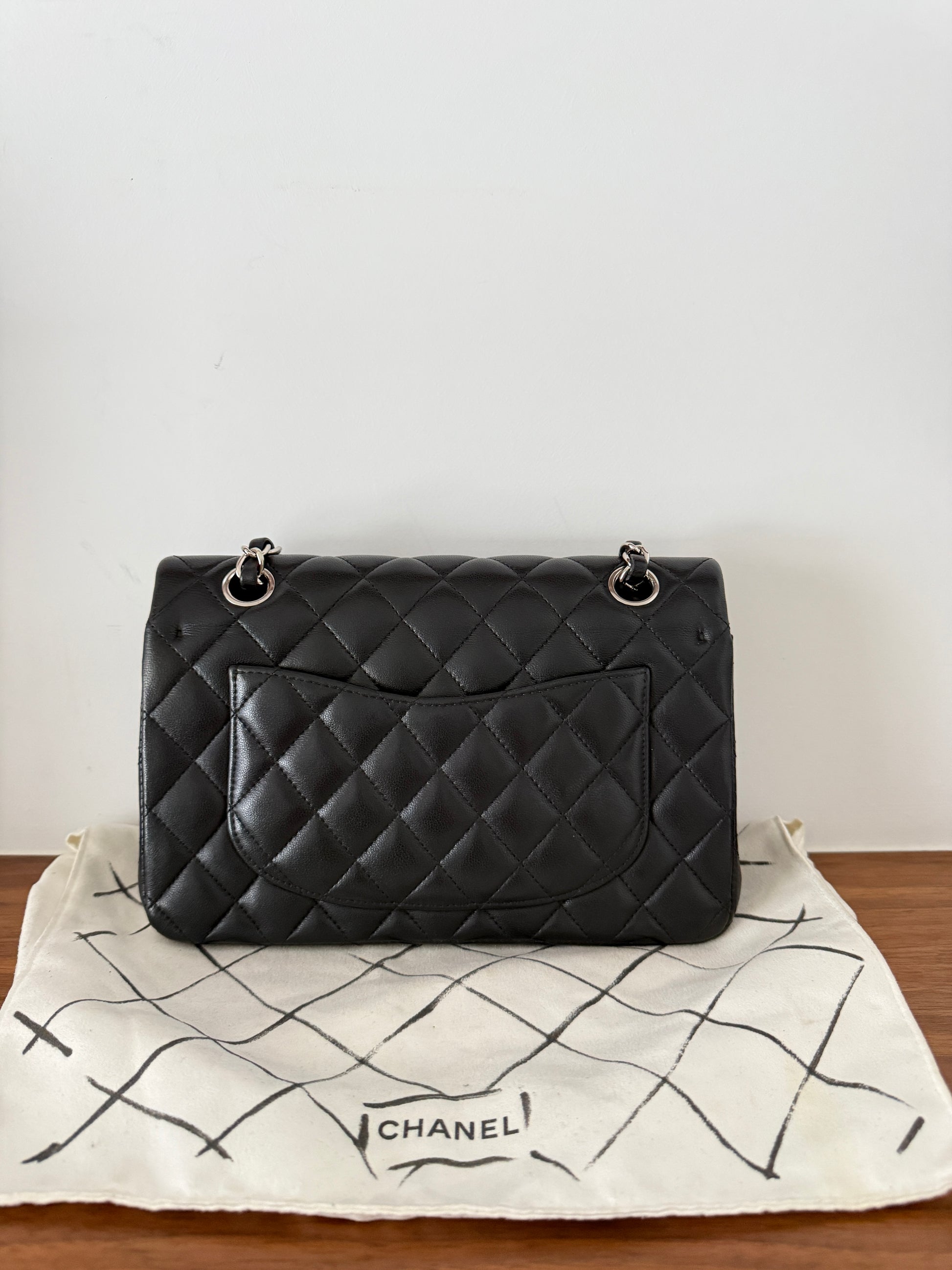 chanel double classic flap small in black lambskin backside of handbag