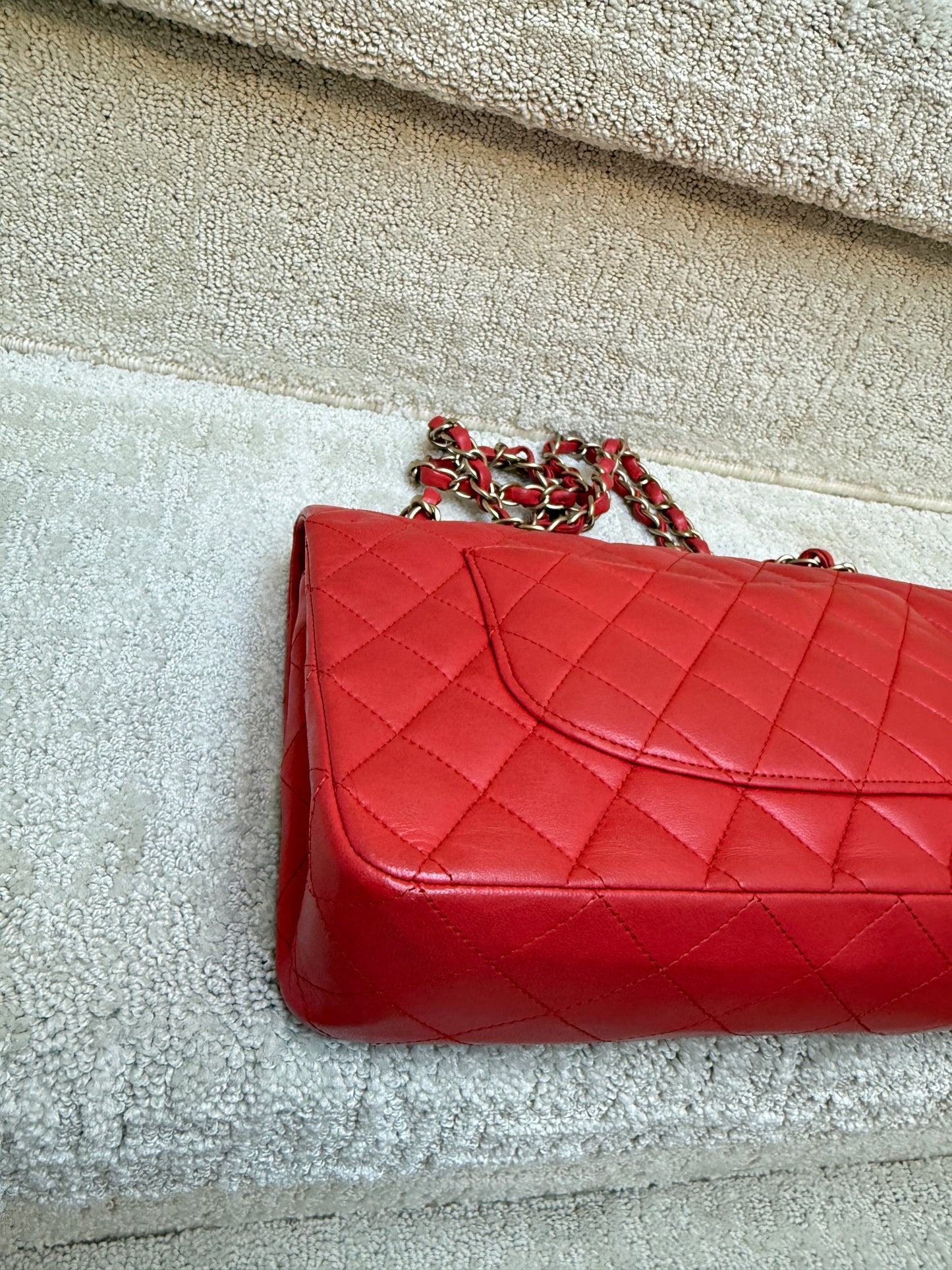 close up of rear back corner without wear of chanel double classic flap in red lambskin 