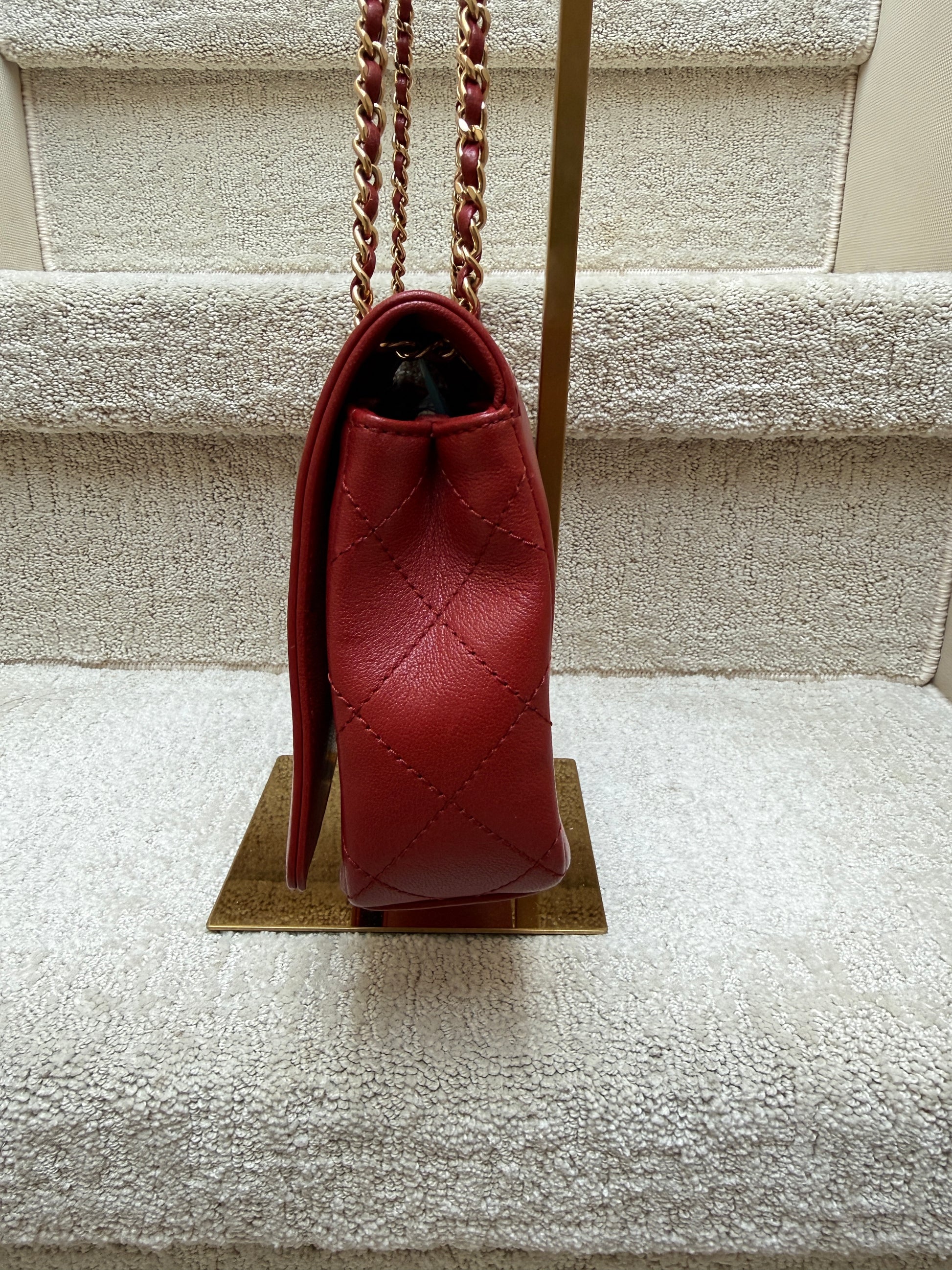 side view of chanel mademoiselle medium flap in red preloved