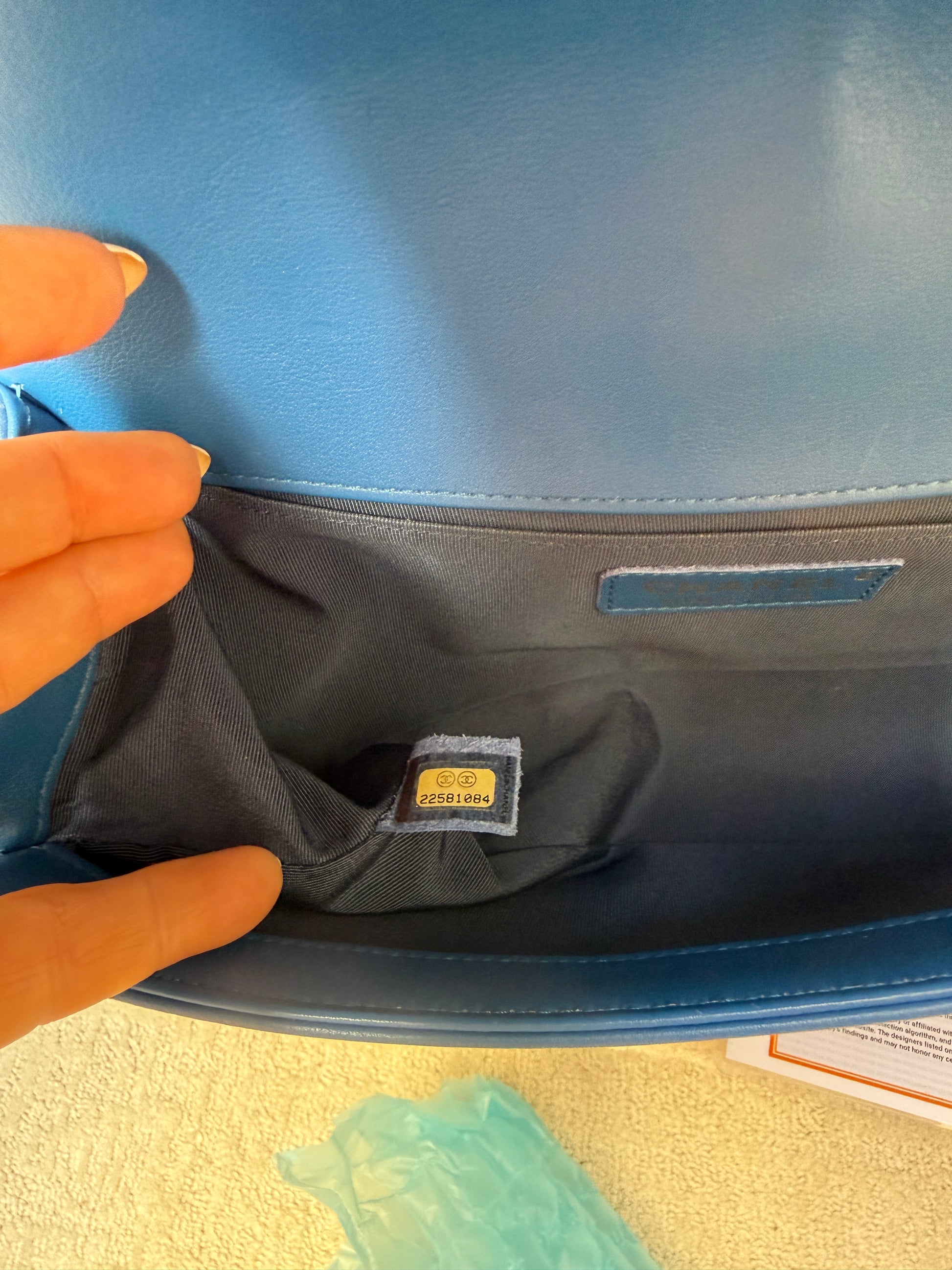 Close up of serial number for chanel boy bag medium Blue