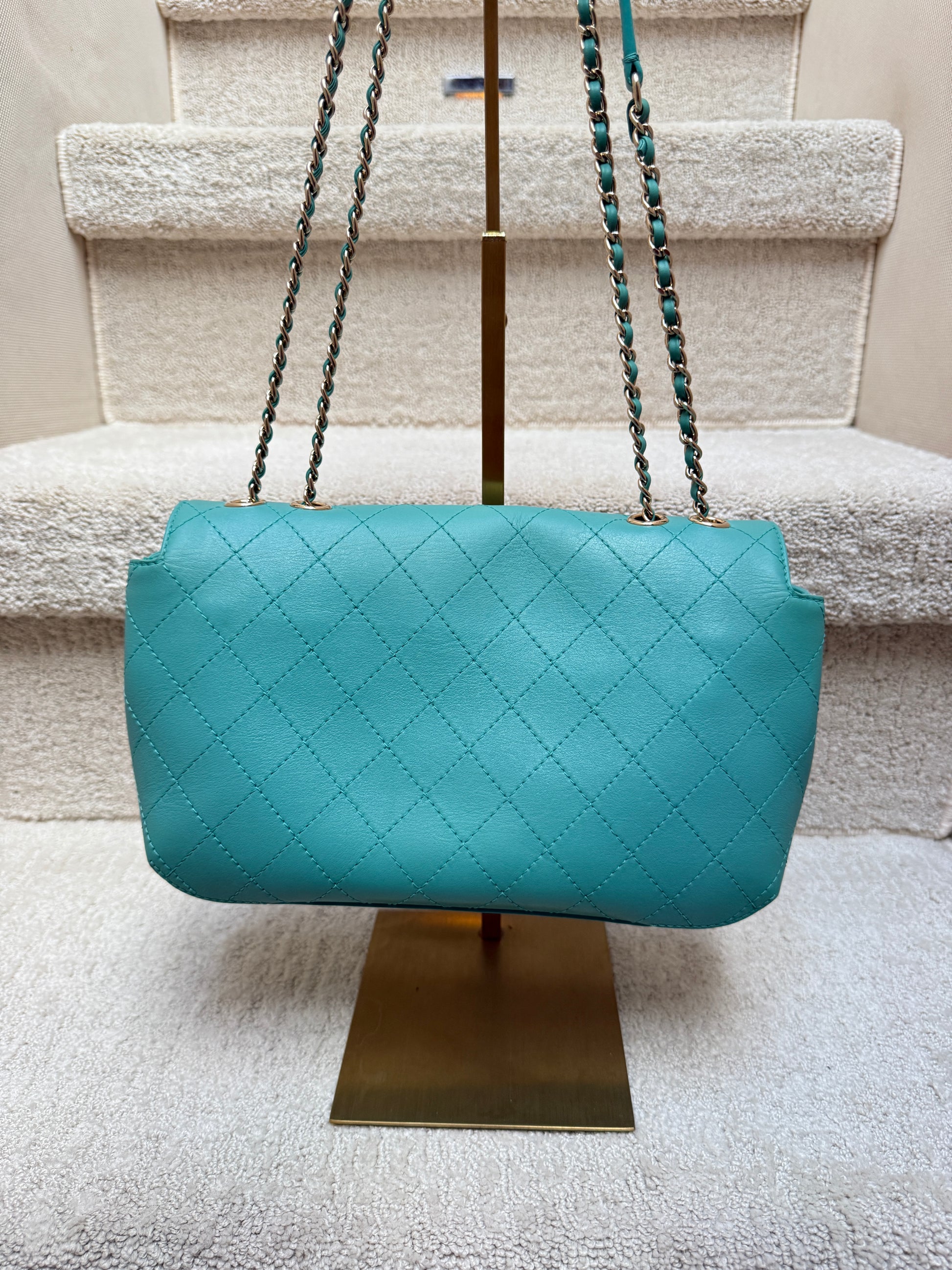 Chanel Medium Calfskin Classic flap view of back side of bag in pristine condition