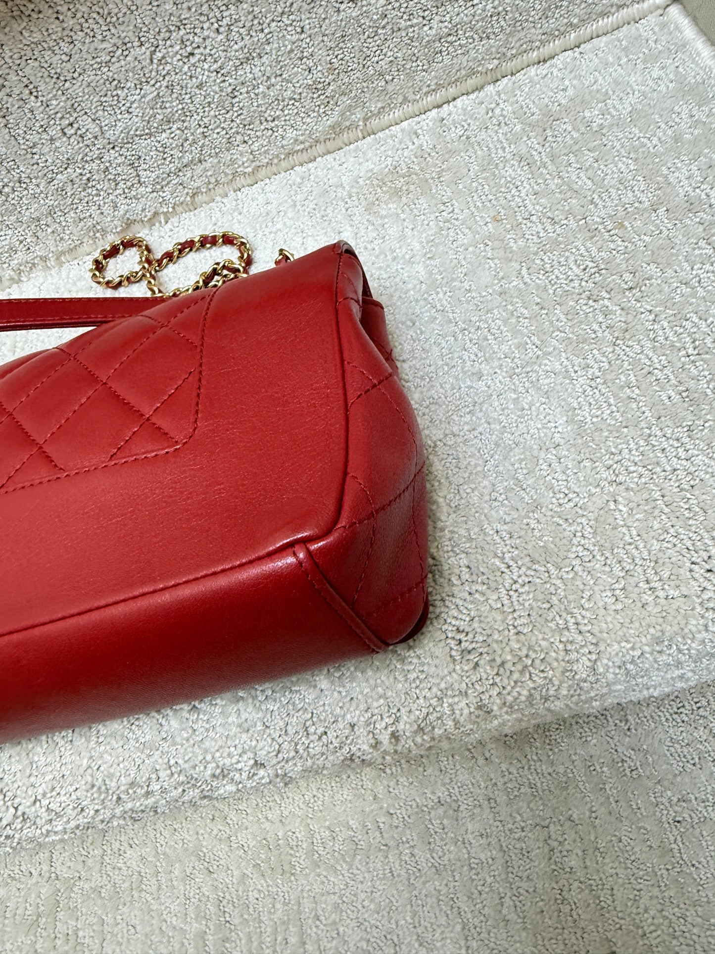 closeup of chanel medium flap in red back corner is clean