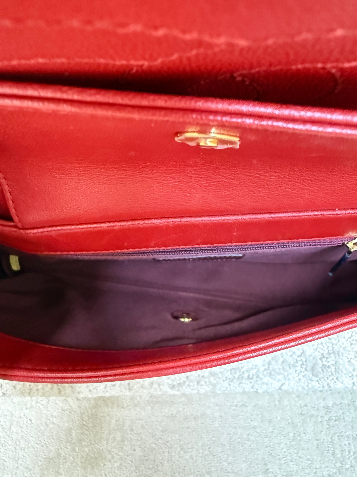 interior photo of chanel mademoiselle medium flap showing burgundy fabric