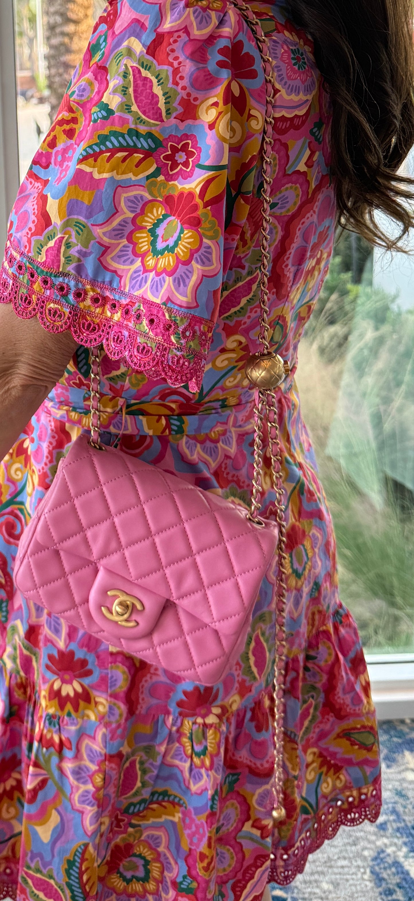 chanel mini pearl crush in pink and gold shown on a woman's shoulder