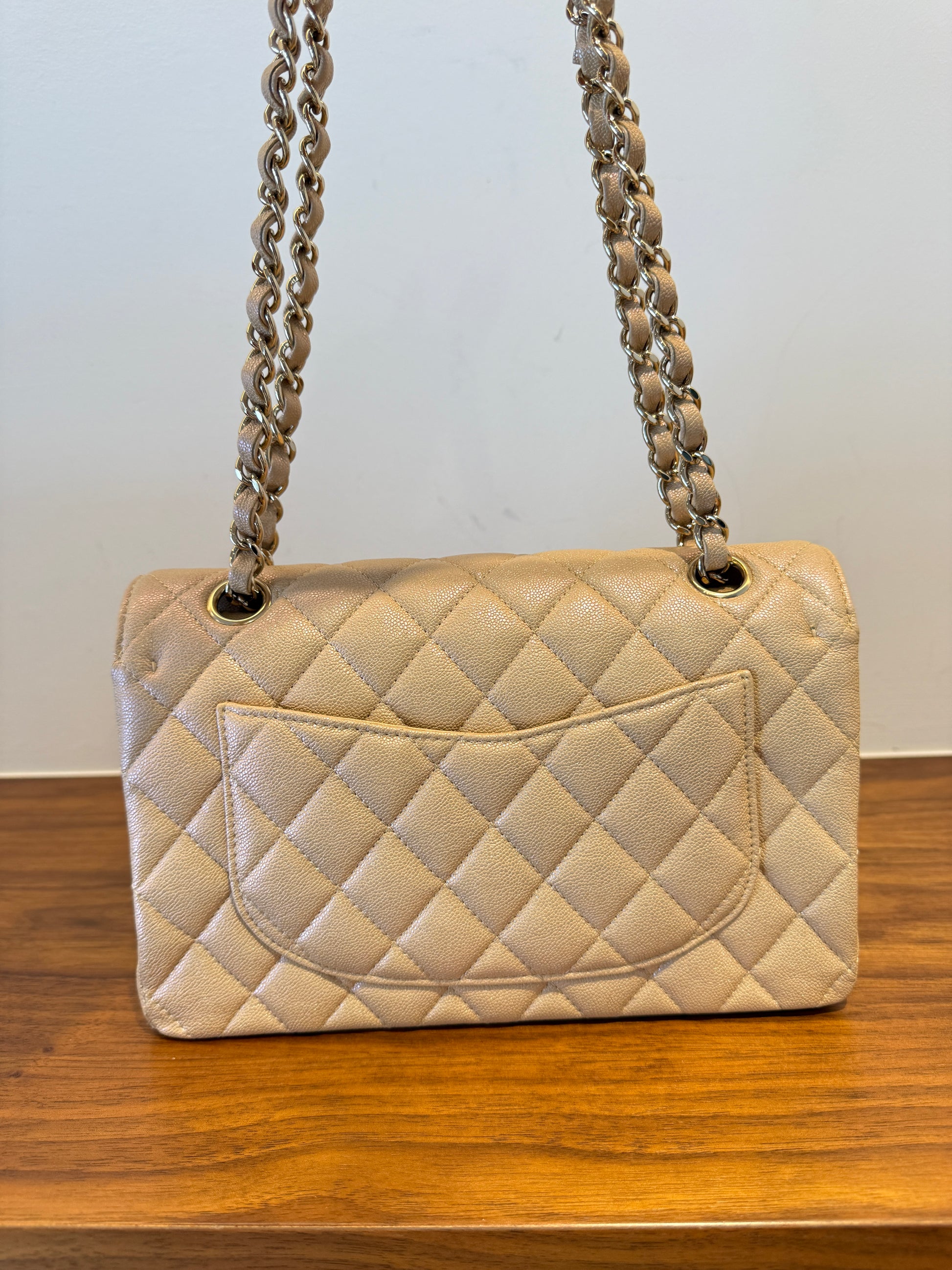 Chanel Small classic double flap in beige caviar picutre of back side of excellent handbag
