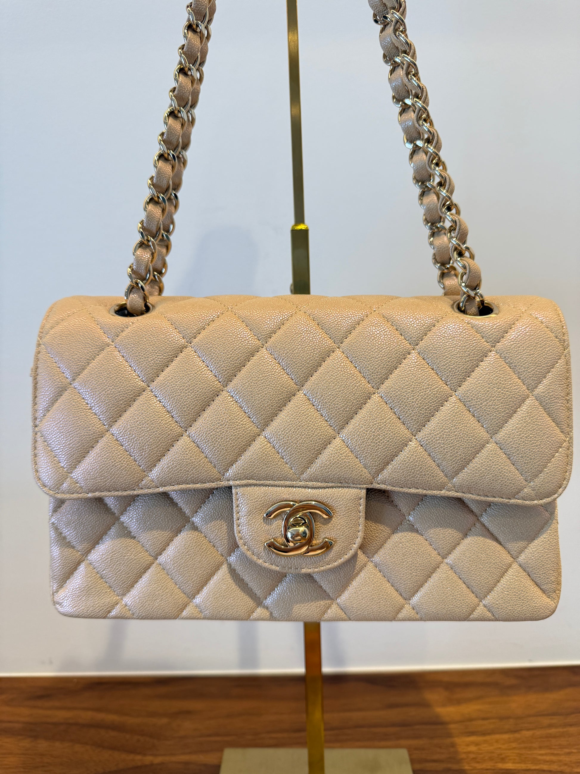 Chanel Small classic double flap in beige caviar leather which has an irridescent shine