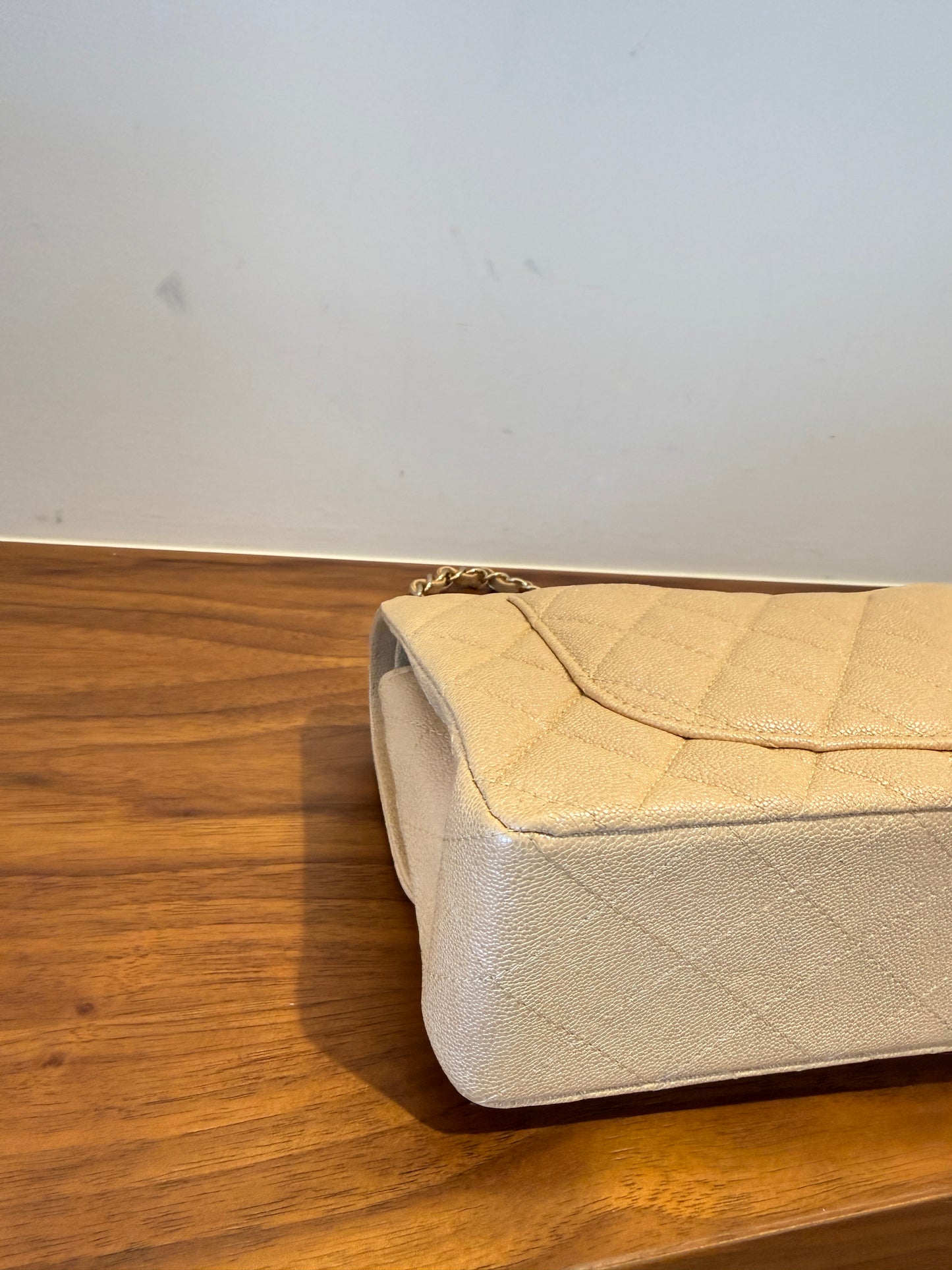 Chanel Small Double classic flap in beige caviar quilted leather close up of back left corner