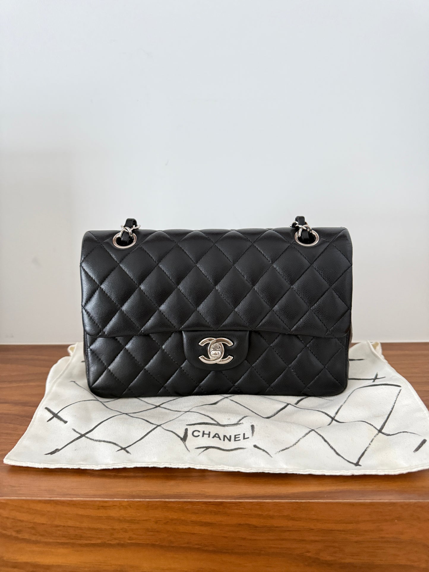 Chanel classic double flap in black lambskin with silver hardware in small size from purseonalshopper preloved