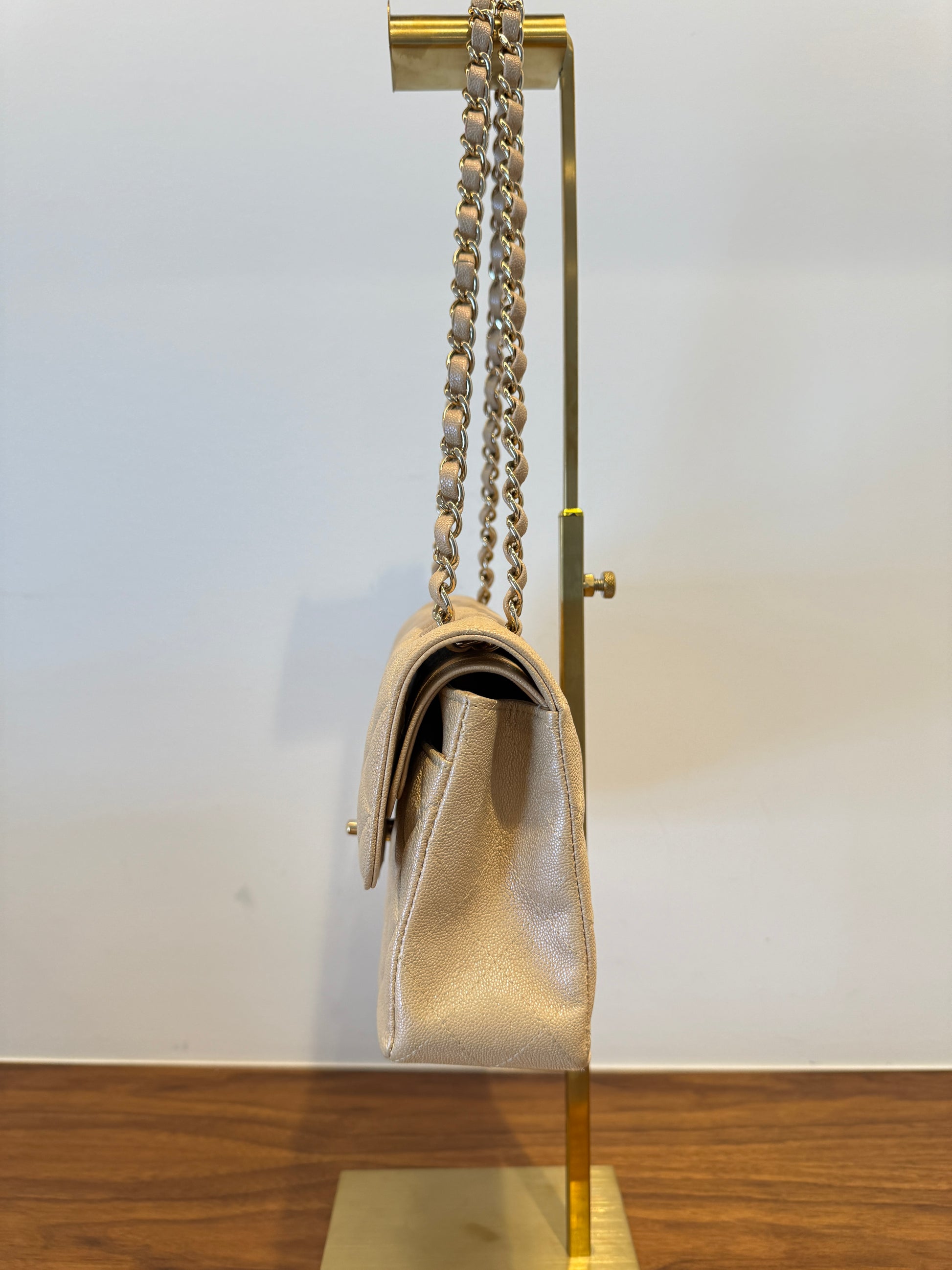 Chanel small beige caviar classic double flap left side view