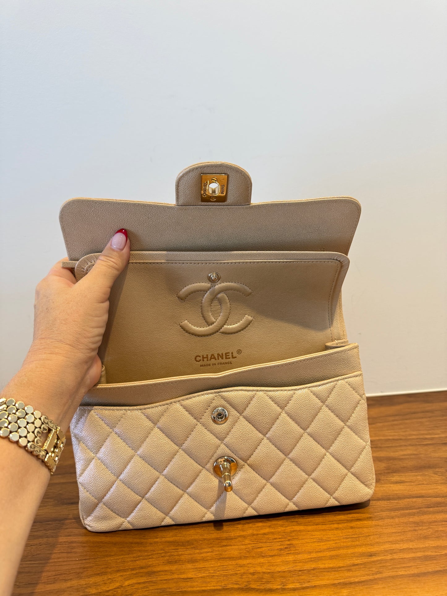 Chanel small classic double flap in caviar beige leather interior view under both flaps