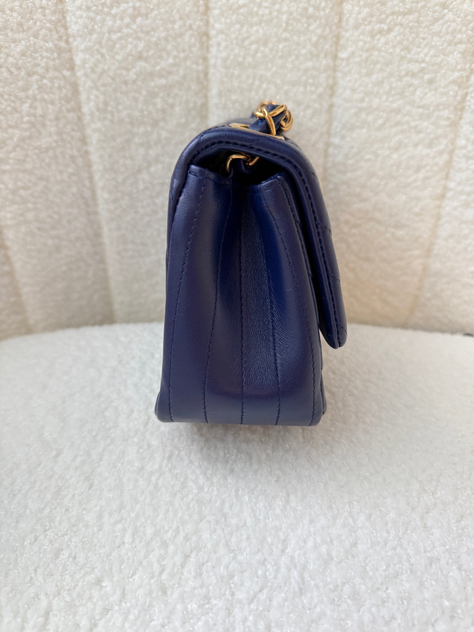 chanel mini square navy side view chevron purse