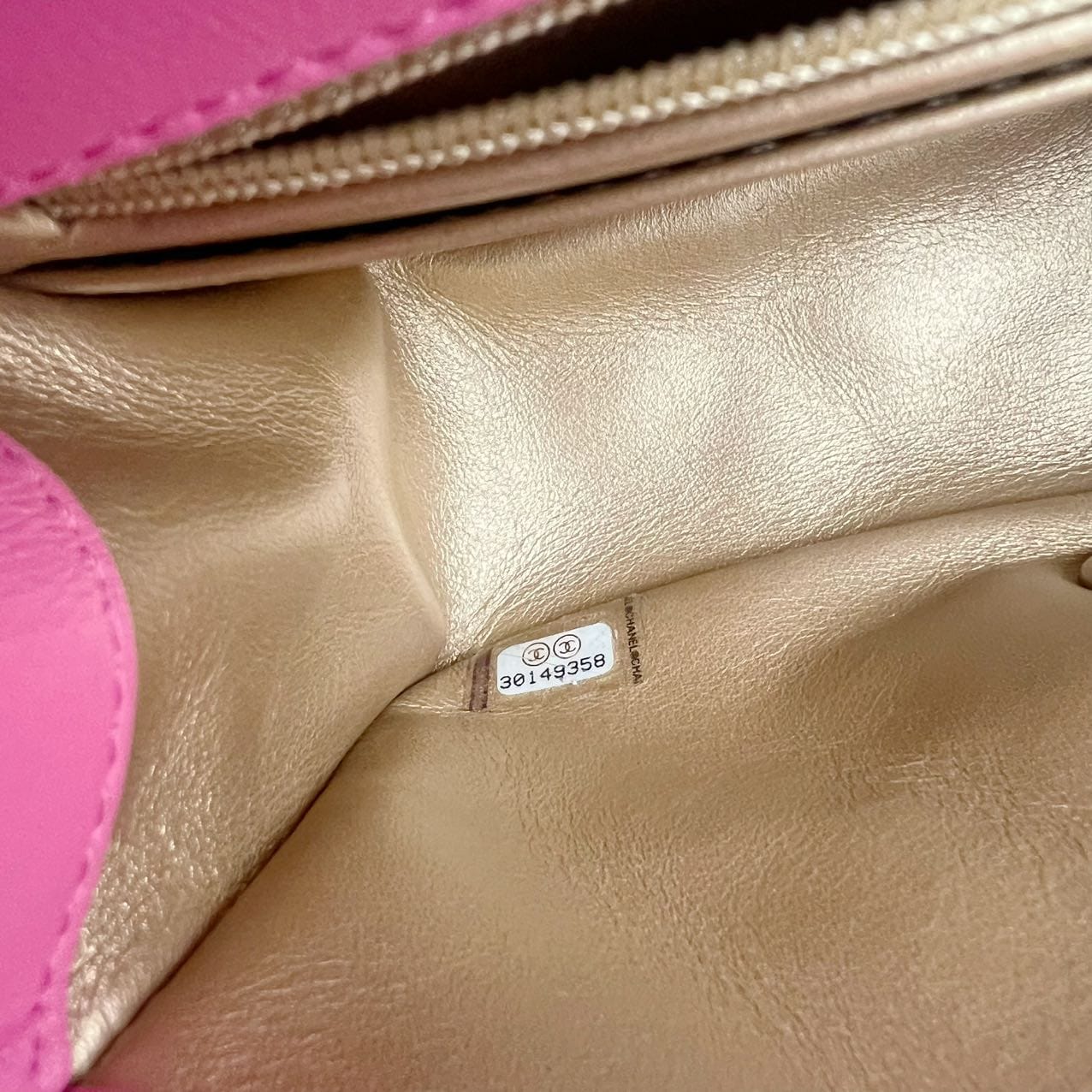 close up of the serial number of a chanel pearl crush square in pink and gold