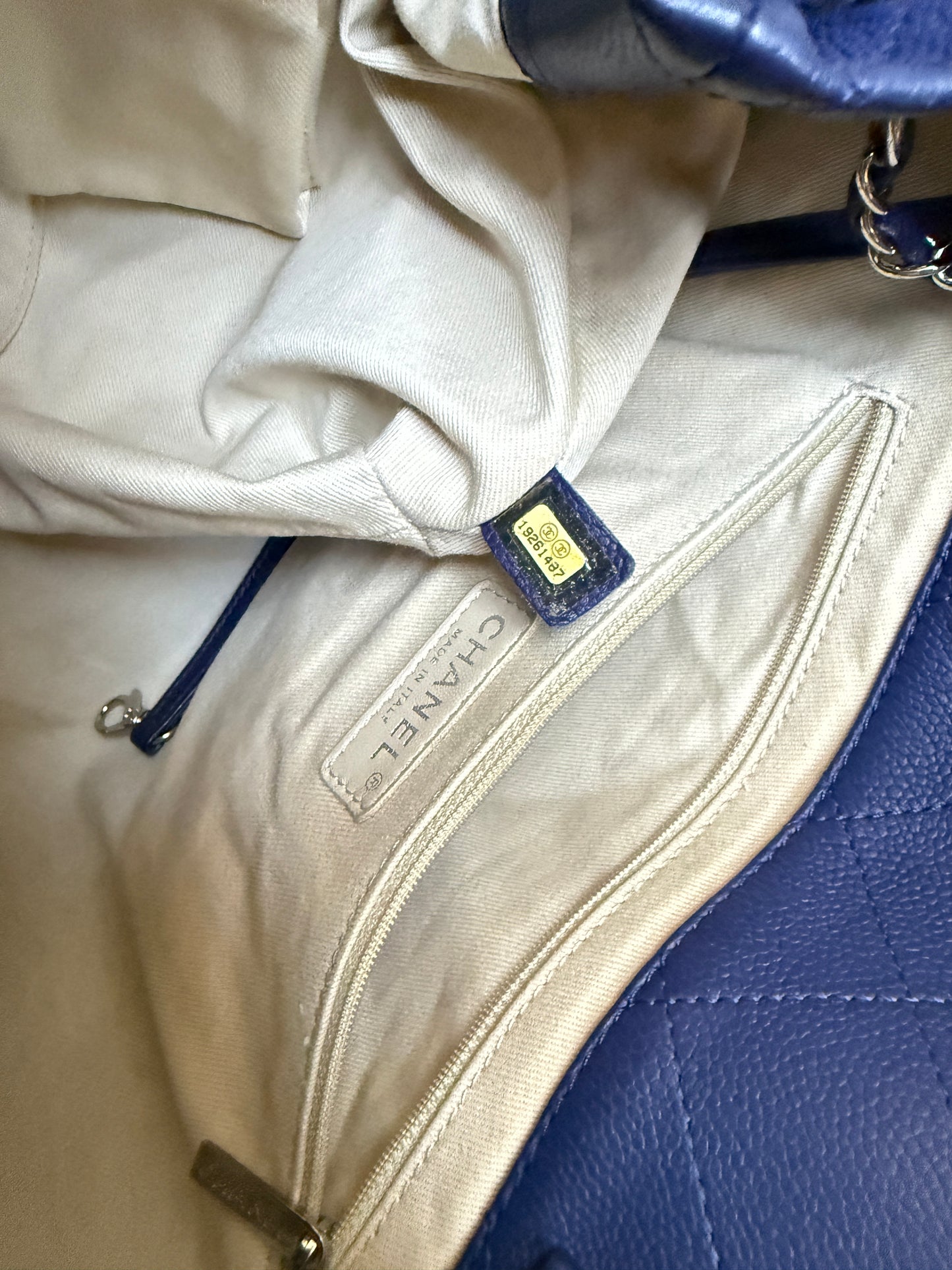 Close-up of a Chanel handbag with visible branding for sale