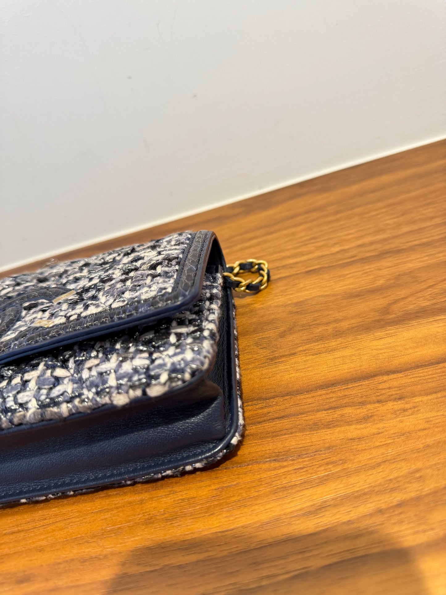 chanel tweed filigree wallet on chain with waternake trim front corner closeup