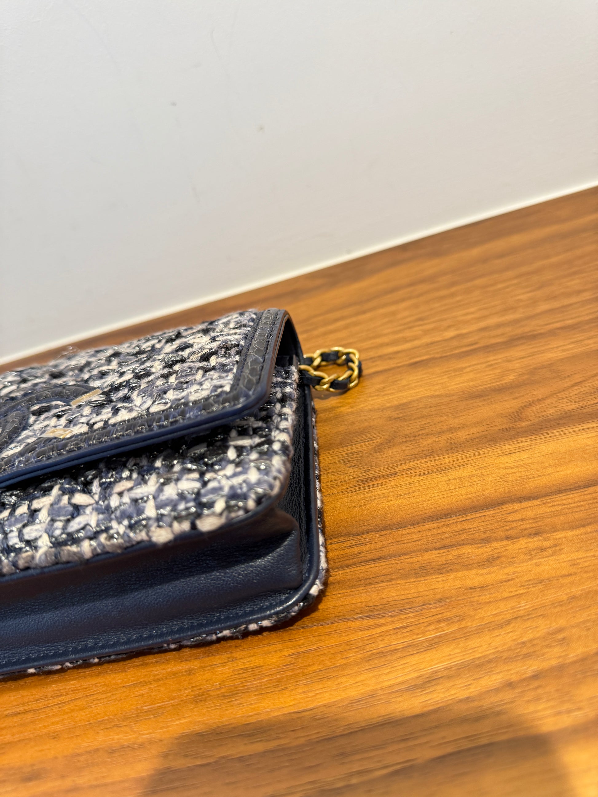 chanel tweed filigree wallet on chain with waternake trim front corner closeup