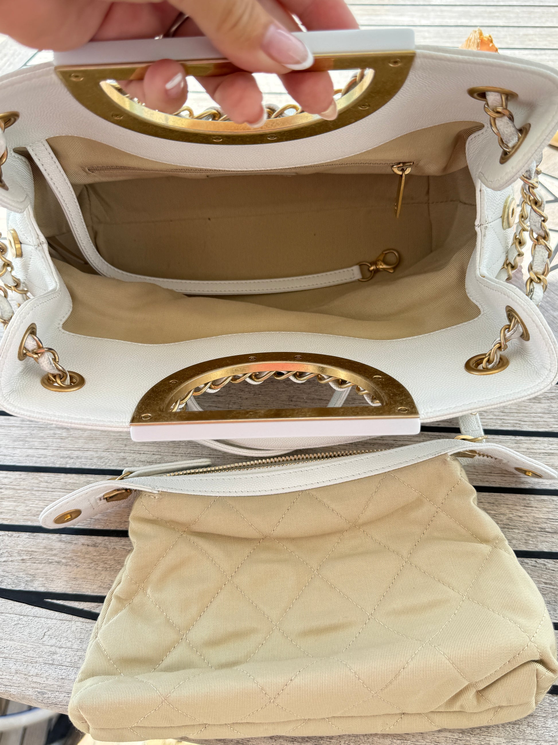 Chanel white caviar a real catch handbag view of interior including a removable zipper pouch