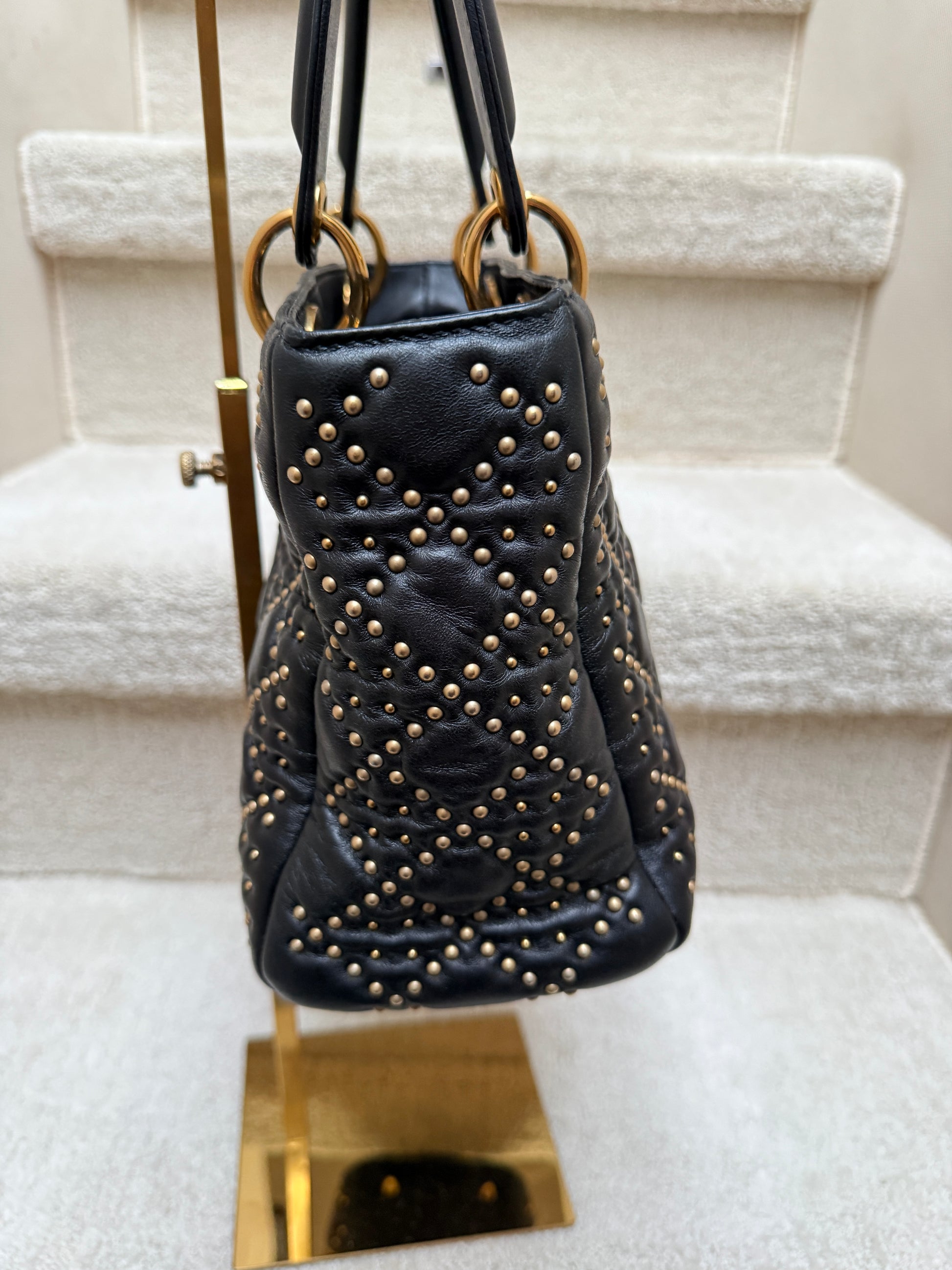 Christian Dior Lady Dior Medium Balck with gold studs side view of handbag resale