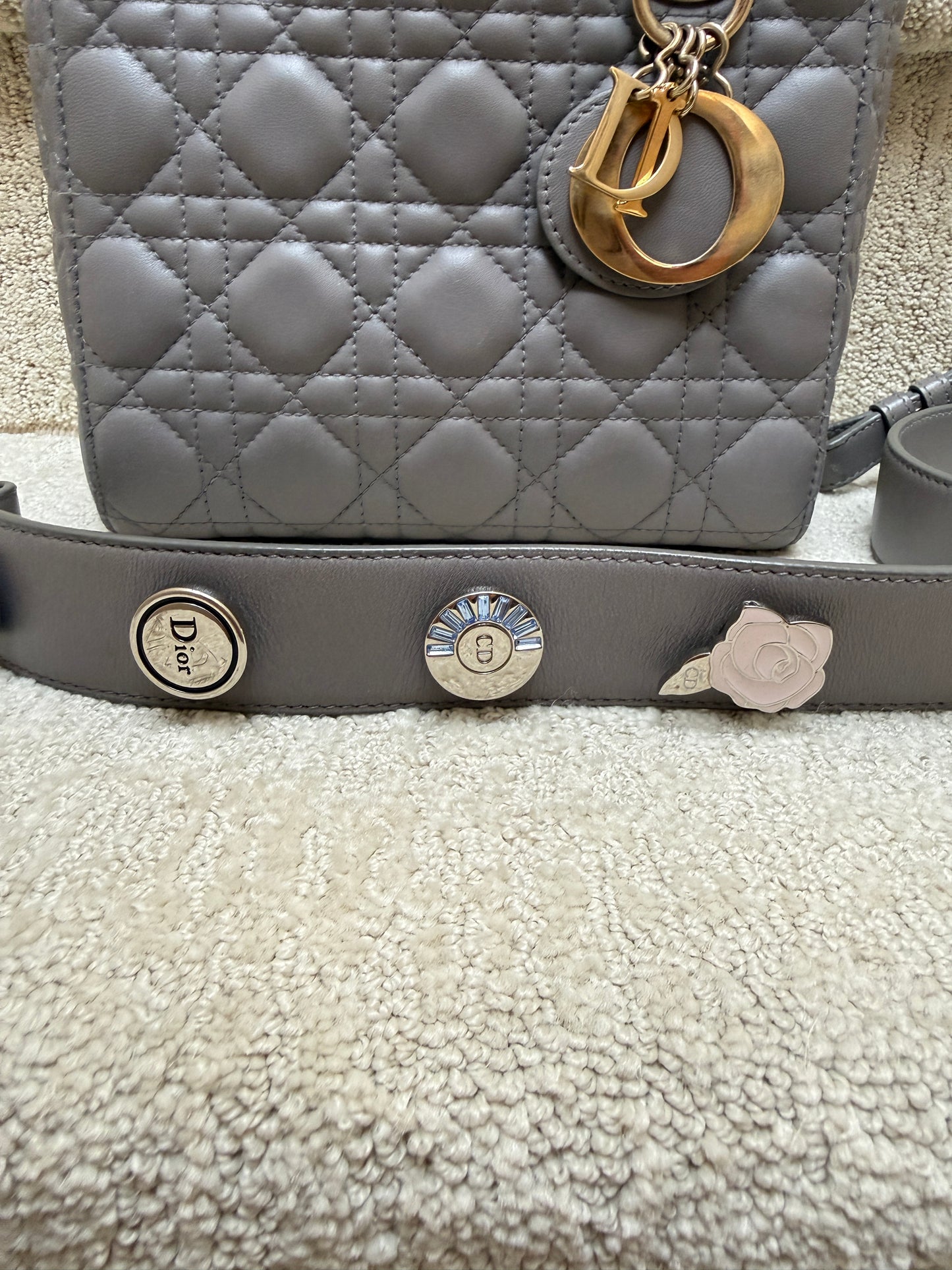 Dior lady dior small handbag close up of abc charms on strap