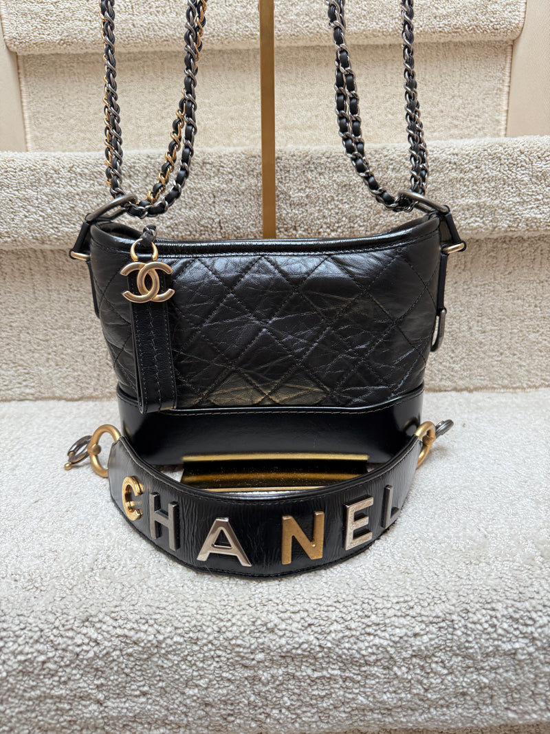 Black quilted Chanel handbag with gold and silver chain authentic and preowned from purseonalshopper