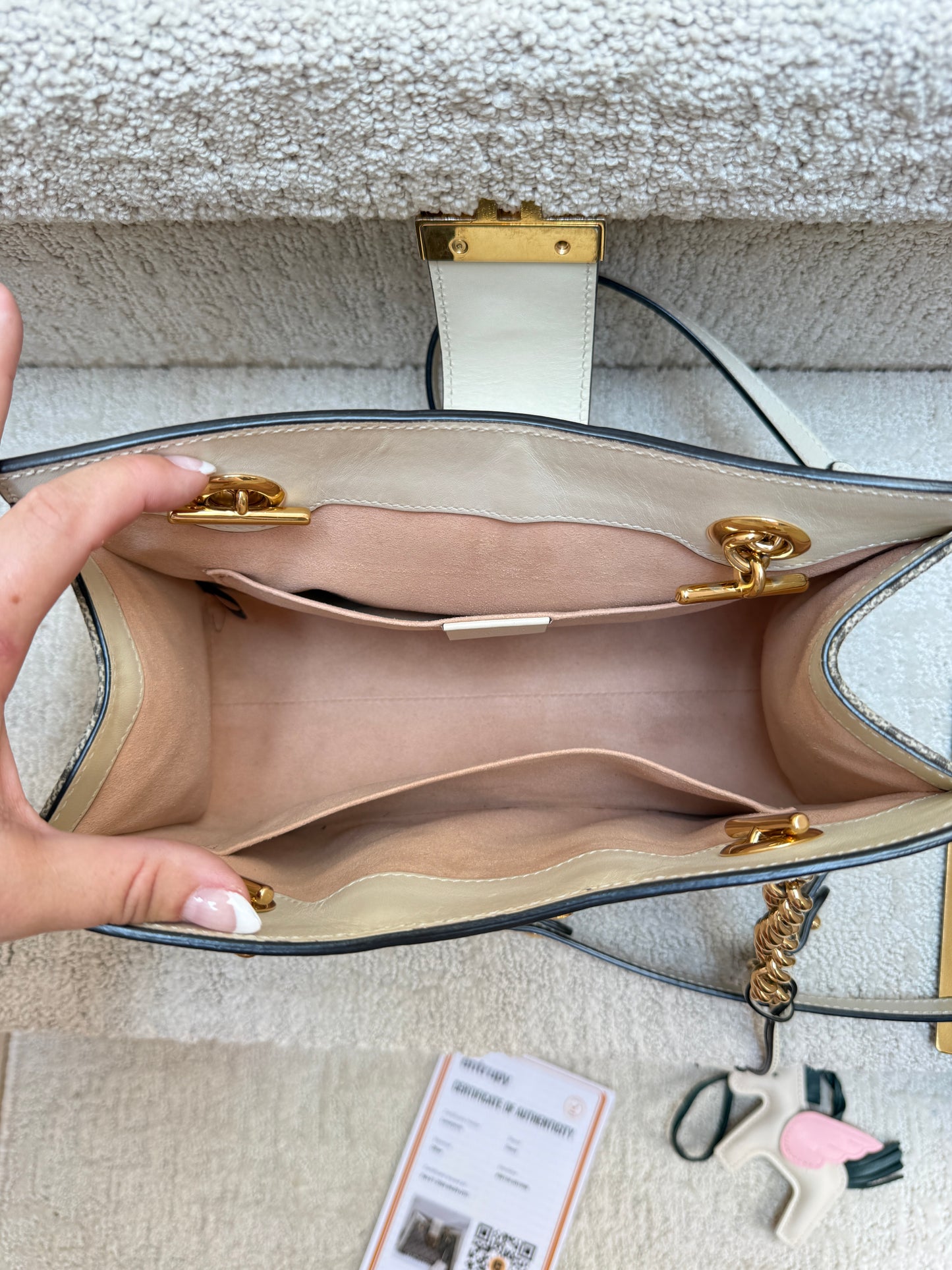 Interior of gucci padlock supreme gg small tote with gold hardware showing blush canvas interior view clean