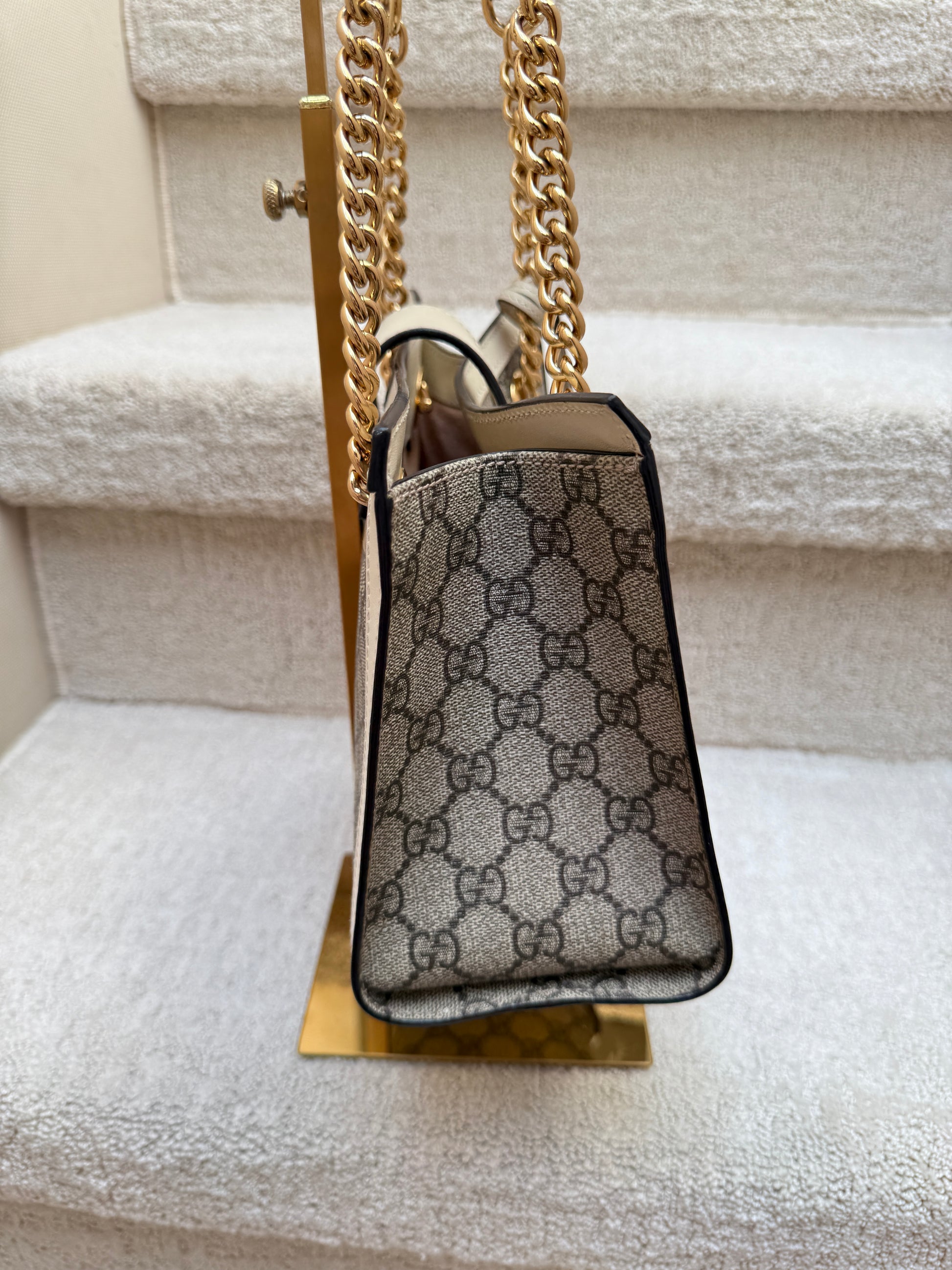 Gucci side view of handbag in gg supreme  used and preowned