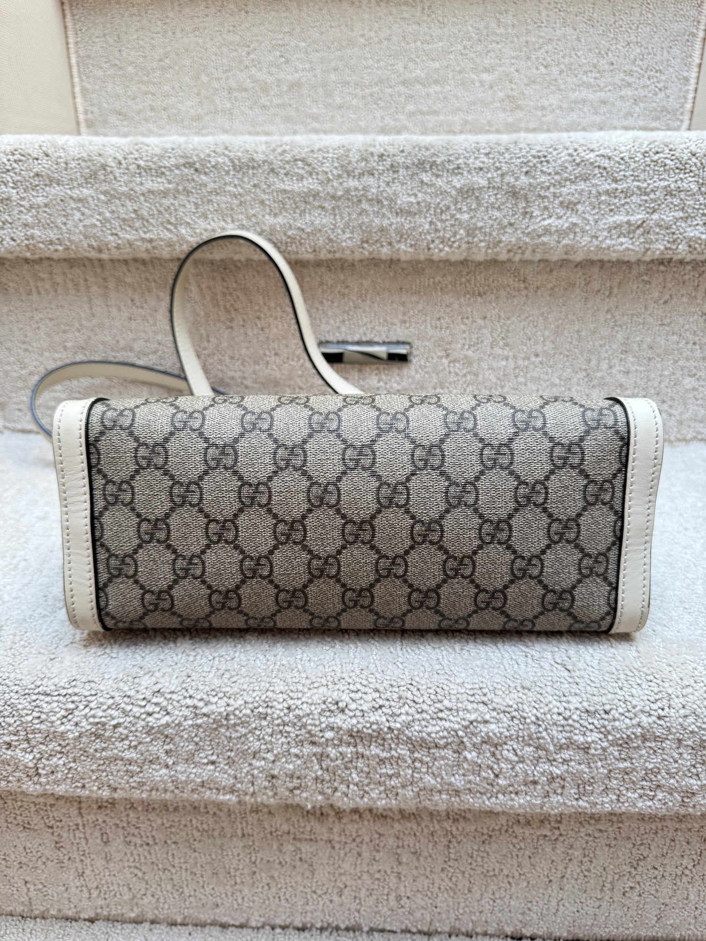 Gucci supreme handbag used in excellent condition showing bottom of handbag clean