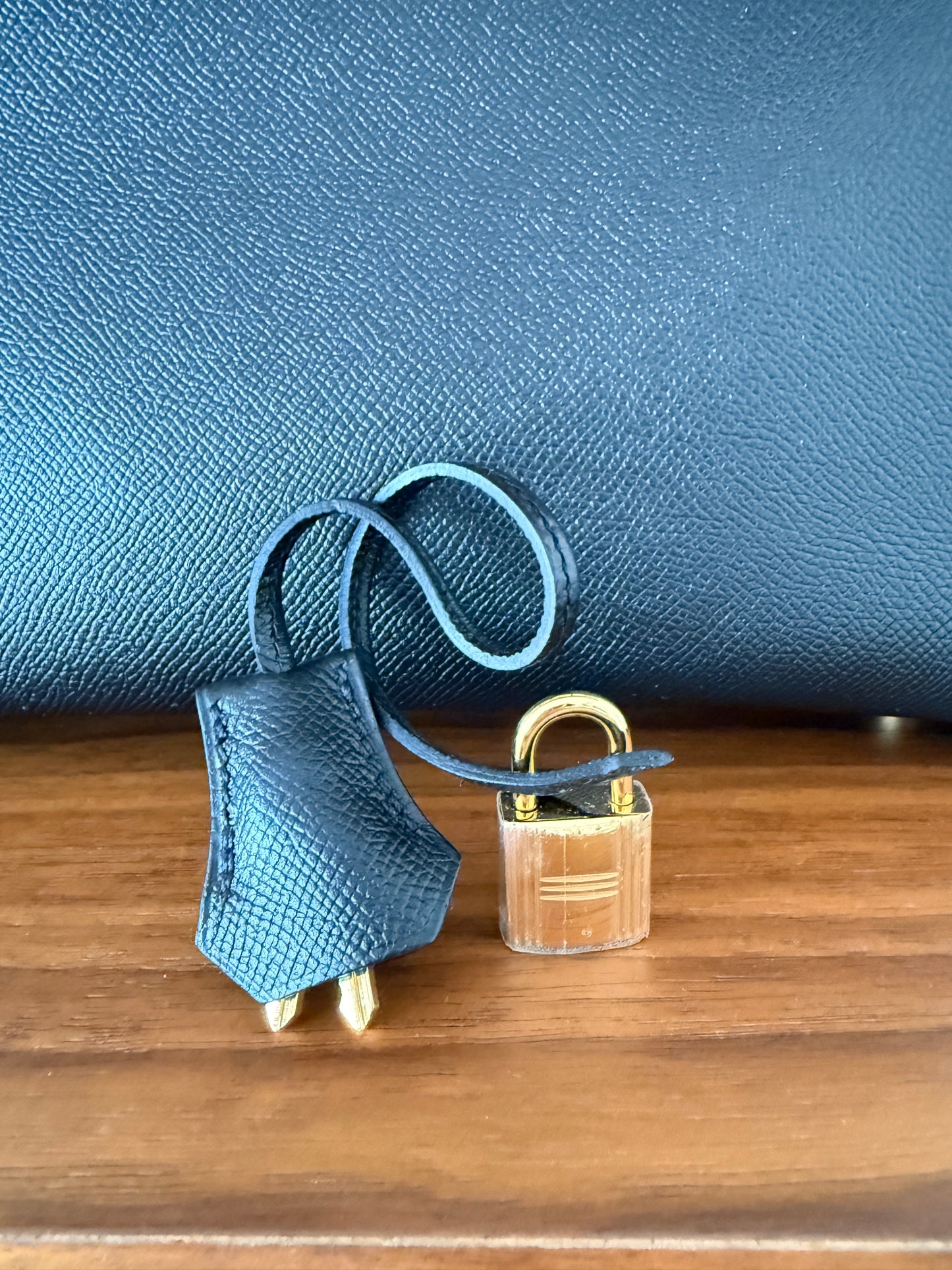 Hermes birkin 30 in Black with close up of lock and keys with plastic on