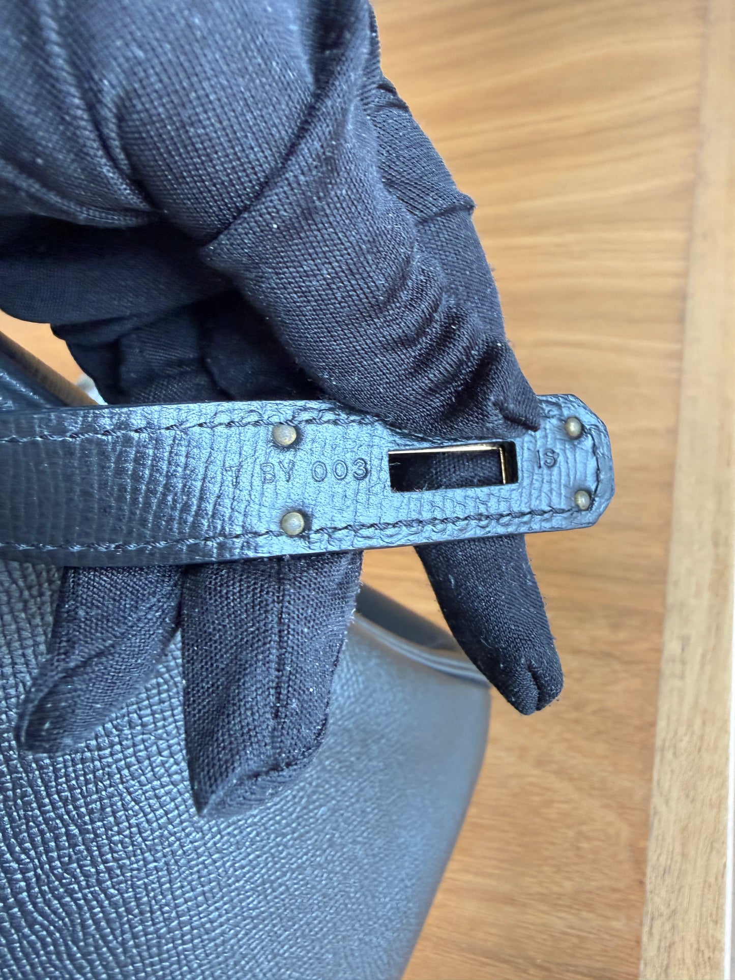 Hermes Birkin 30 in Black Epsom leather showing close up serial number stamp