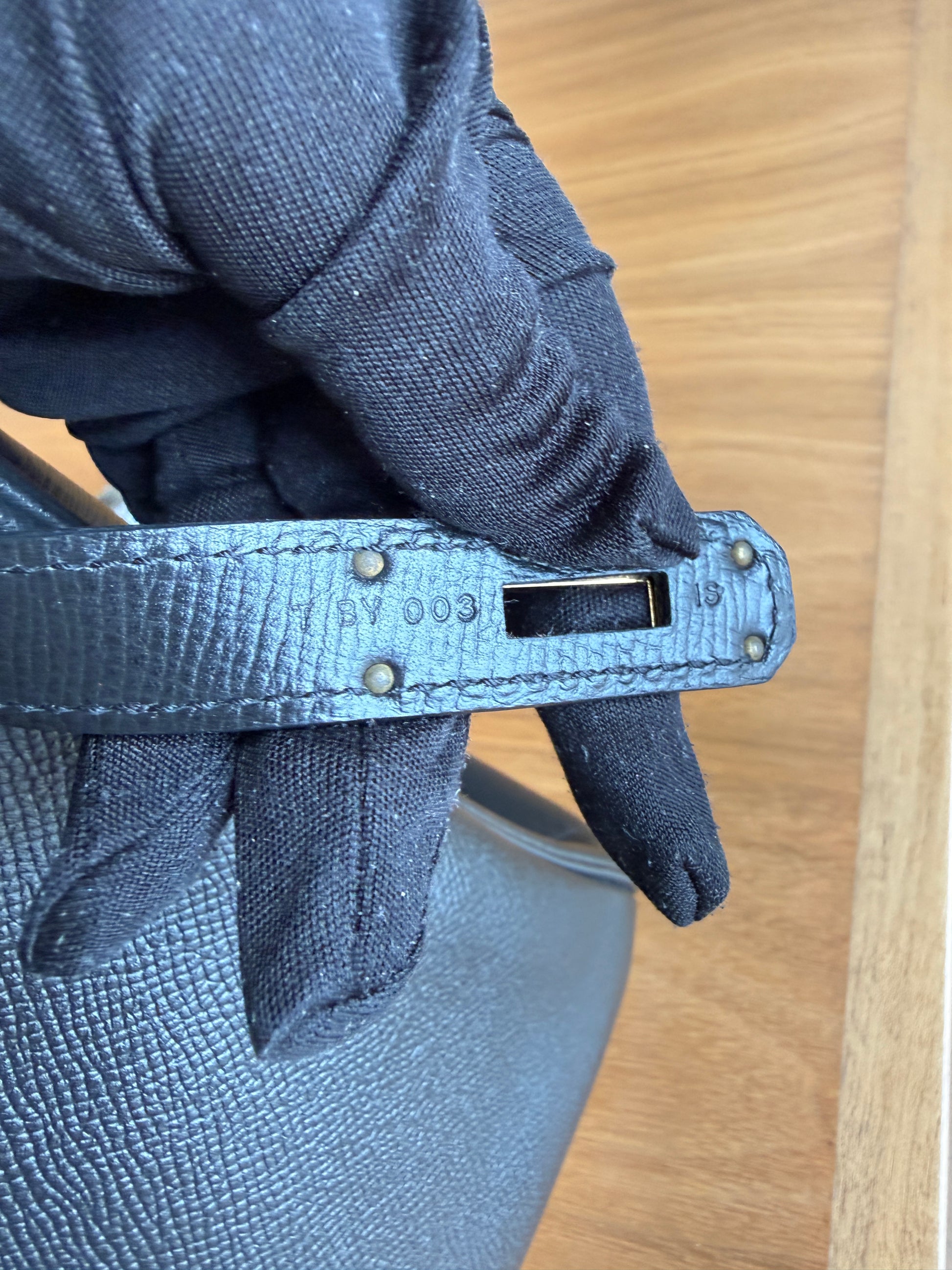 Hermes Birkin 30 in Black Epsom leather showing close up serial number stamp