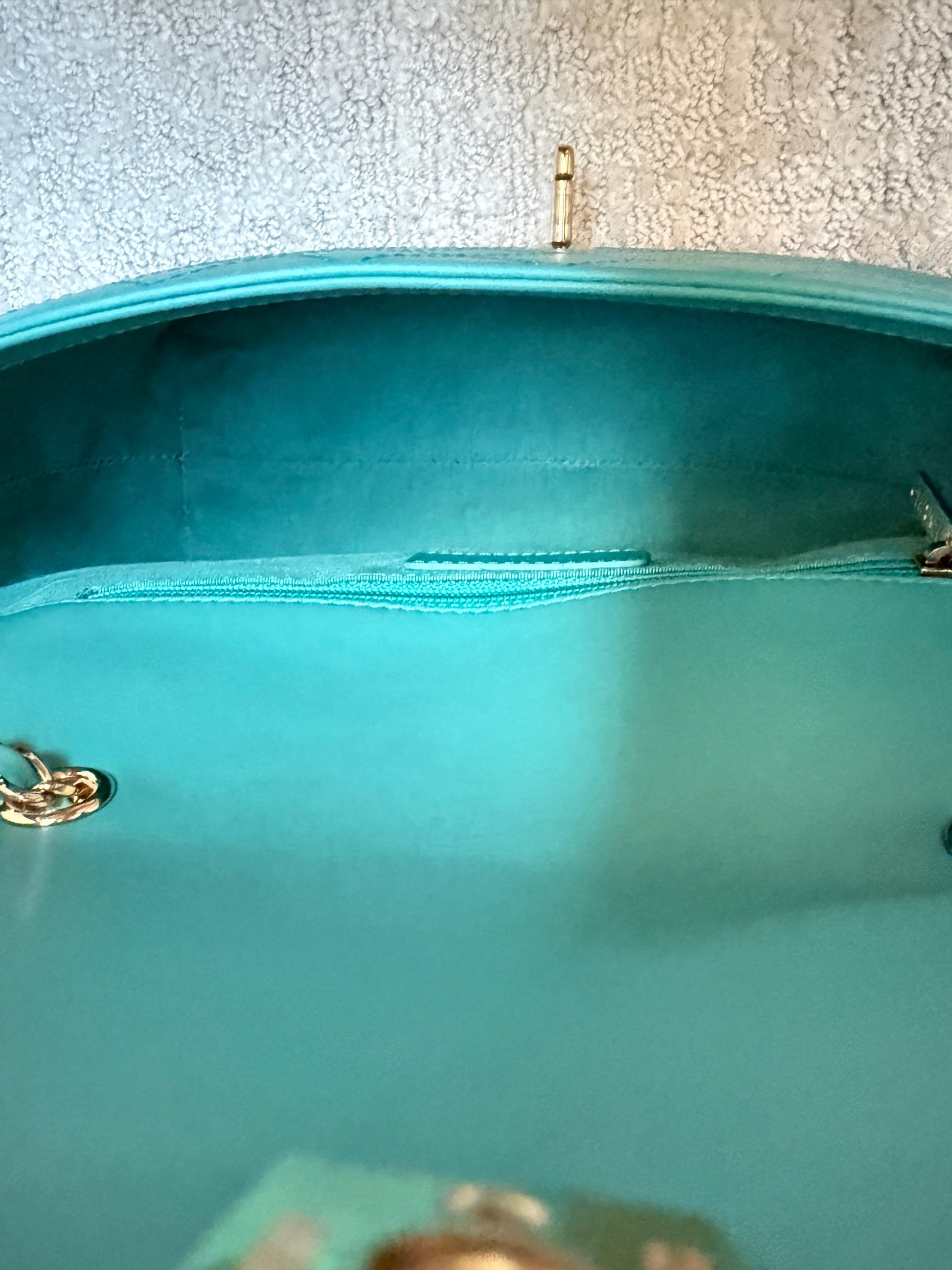 Interior view of pre-owned Chanel turquoise calfskin flap bag