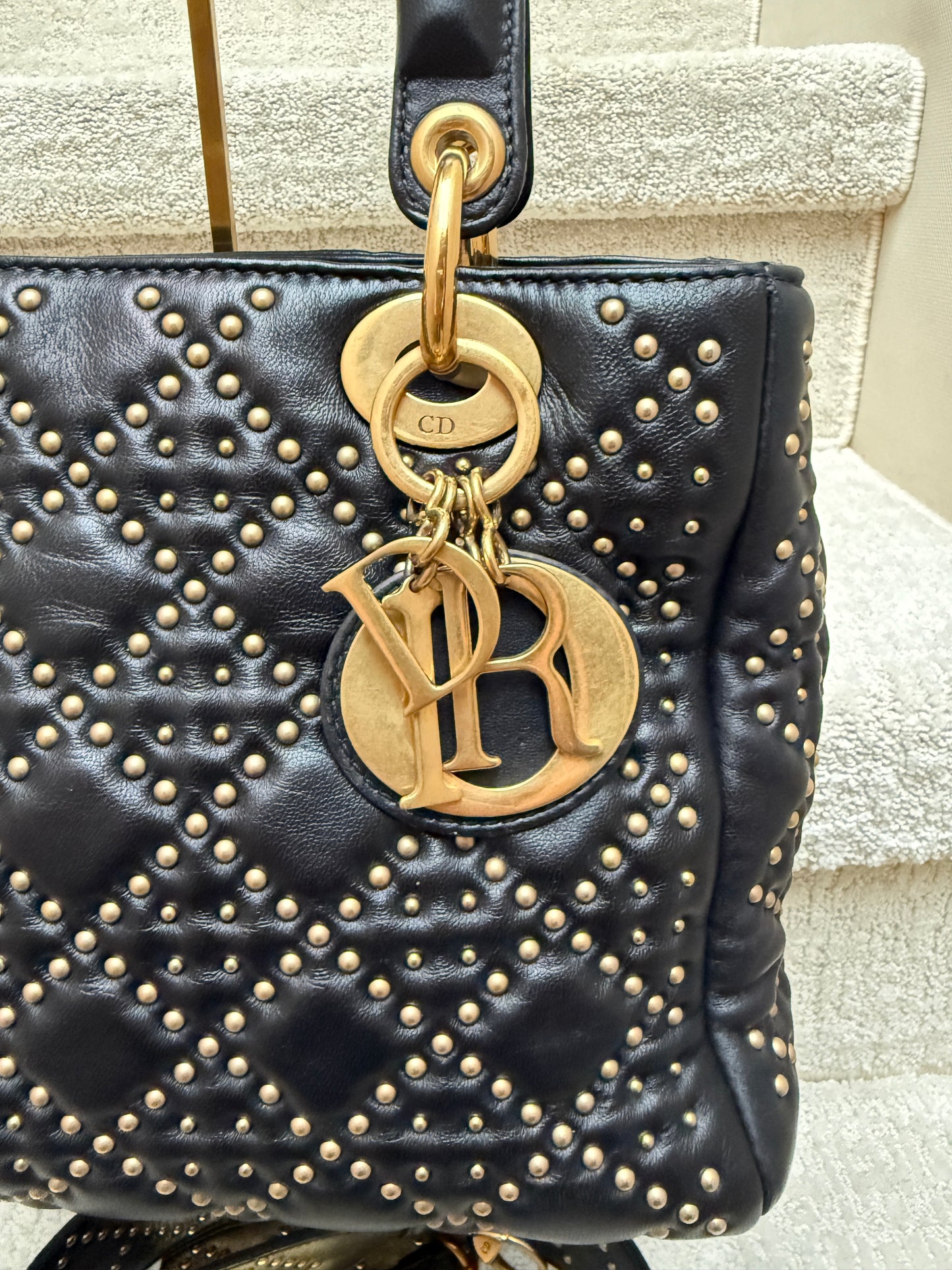 Lady Dior Black & Gold close up of gold dior charms