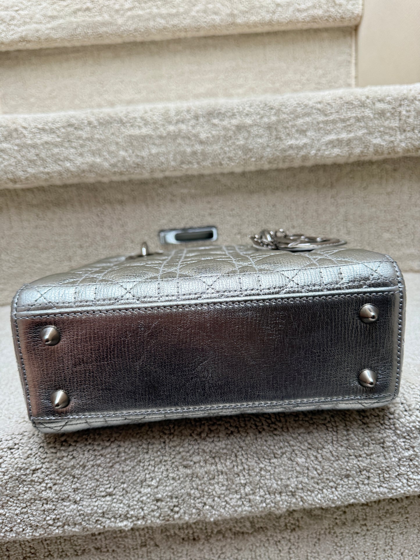 Lady Dior Handbag showing bottom of bag for sale with feet and clean condition