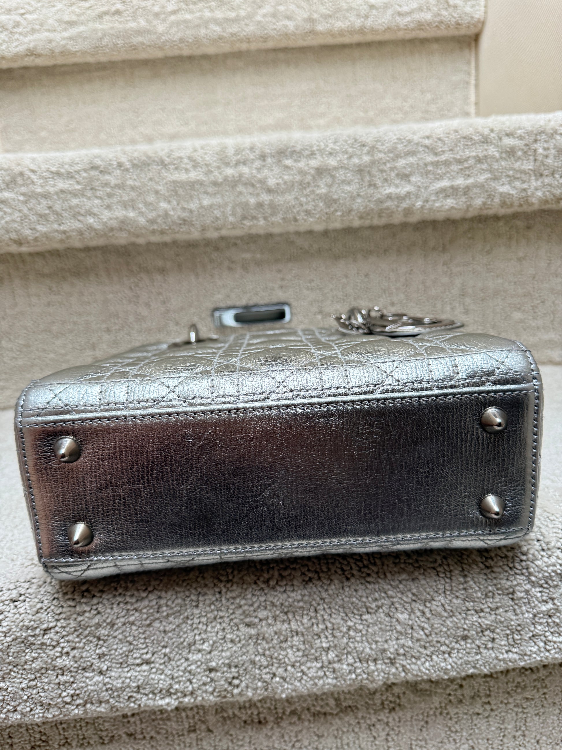 Lady Dior Handbag showing bottom of bag for sale with feet and clean condition