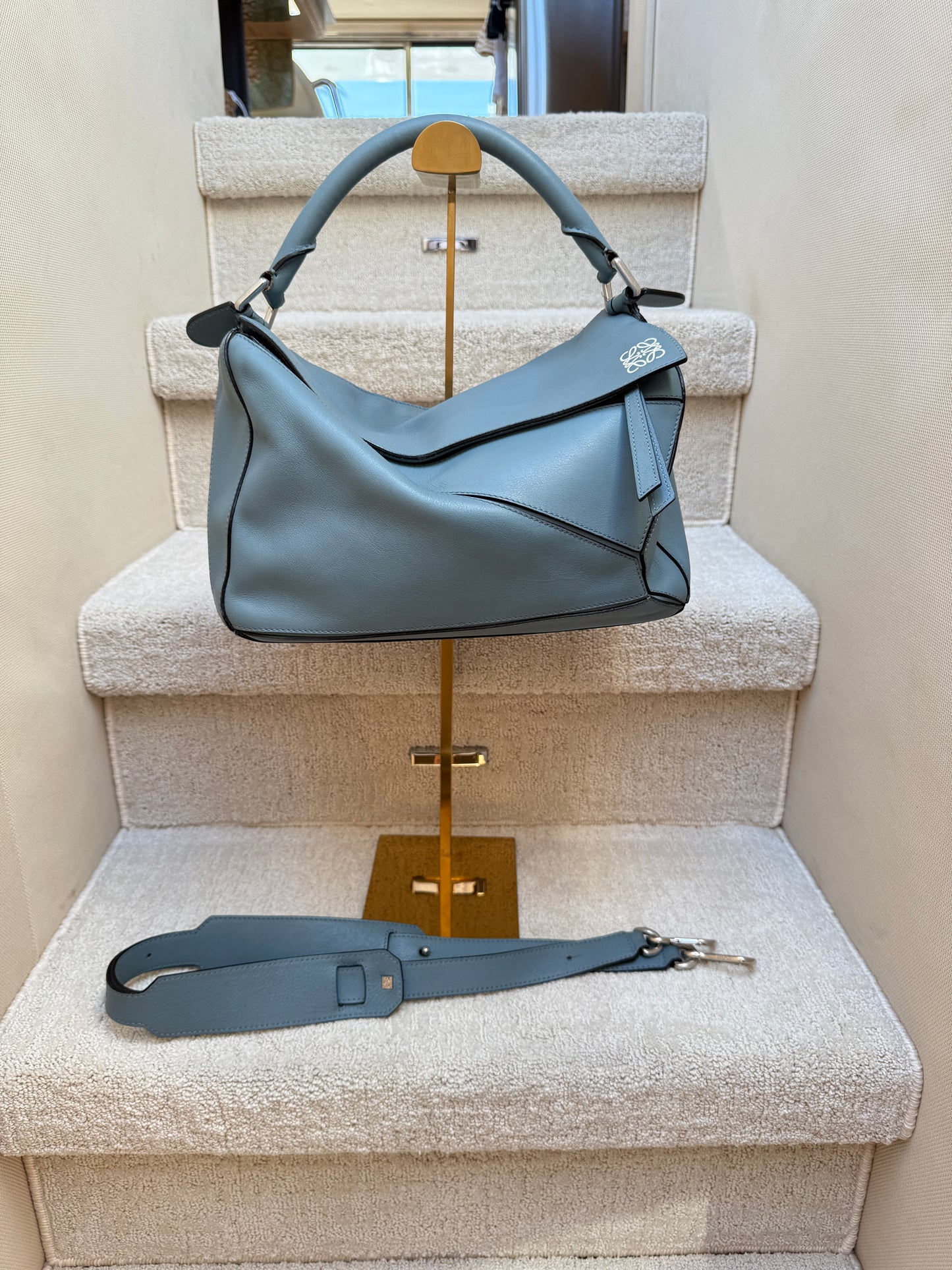 Loewe puzzle handbag in size medium in a grey blue colour is authentic and preowned and offered for sale from purseonalshopper