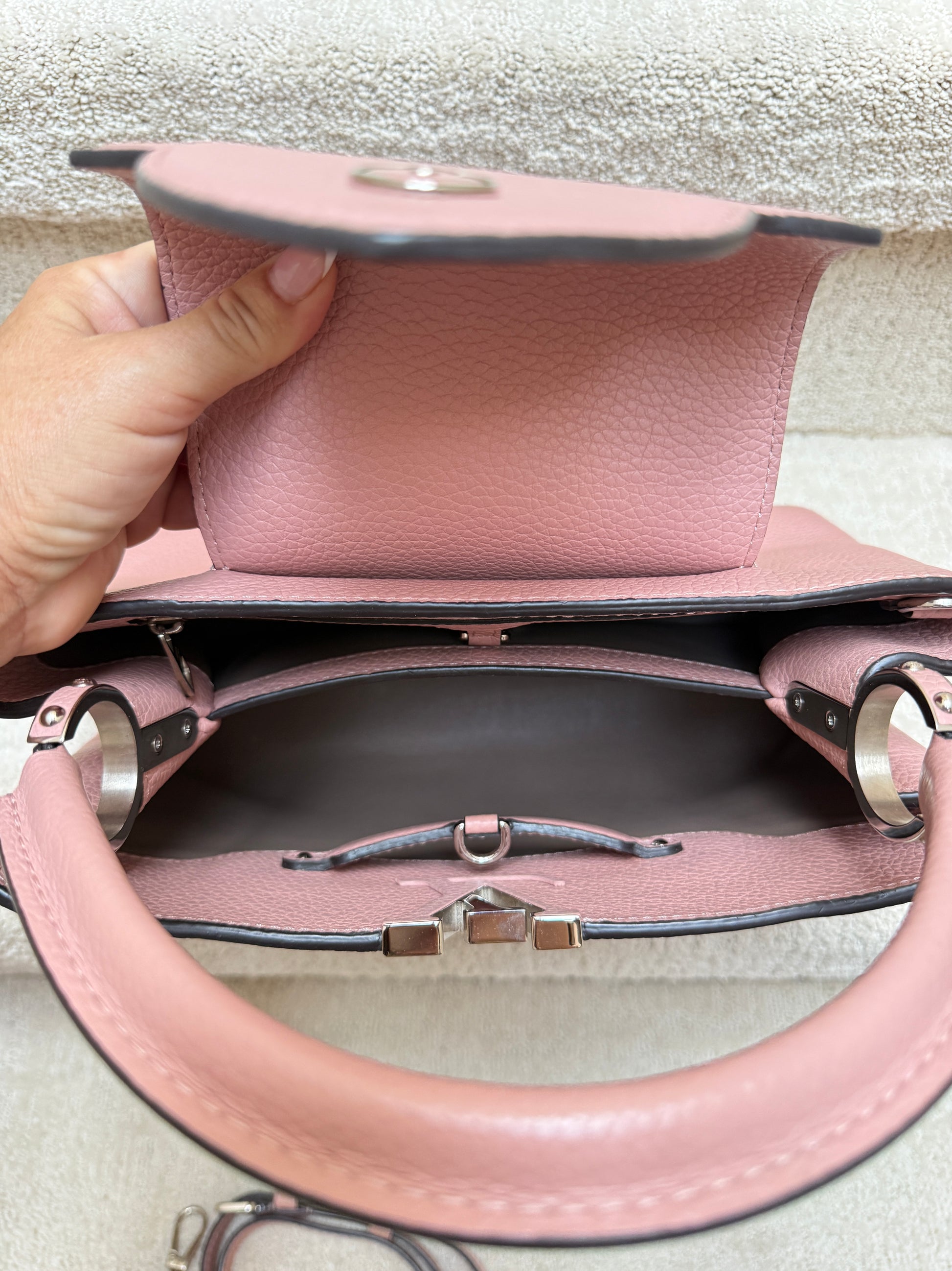 Close-up of interior of louis vuitton capucines bag pm pink used